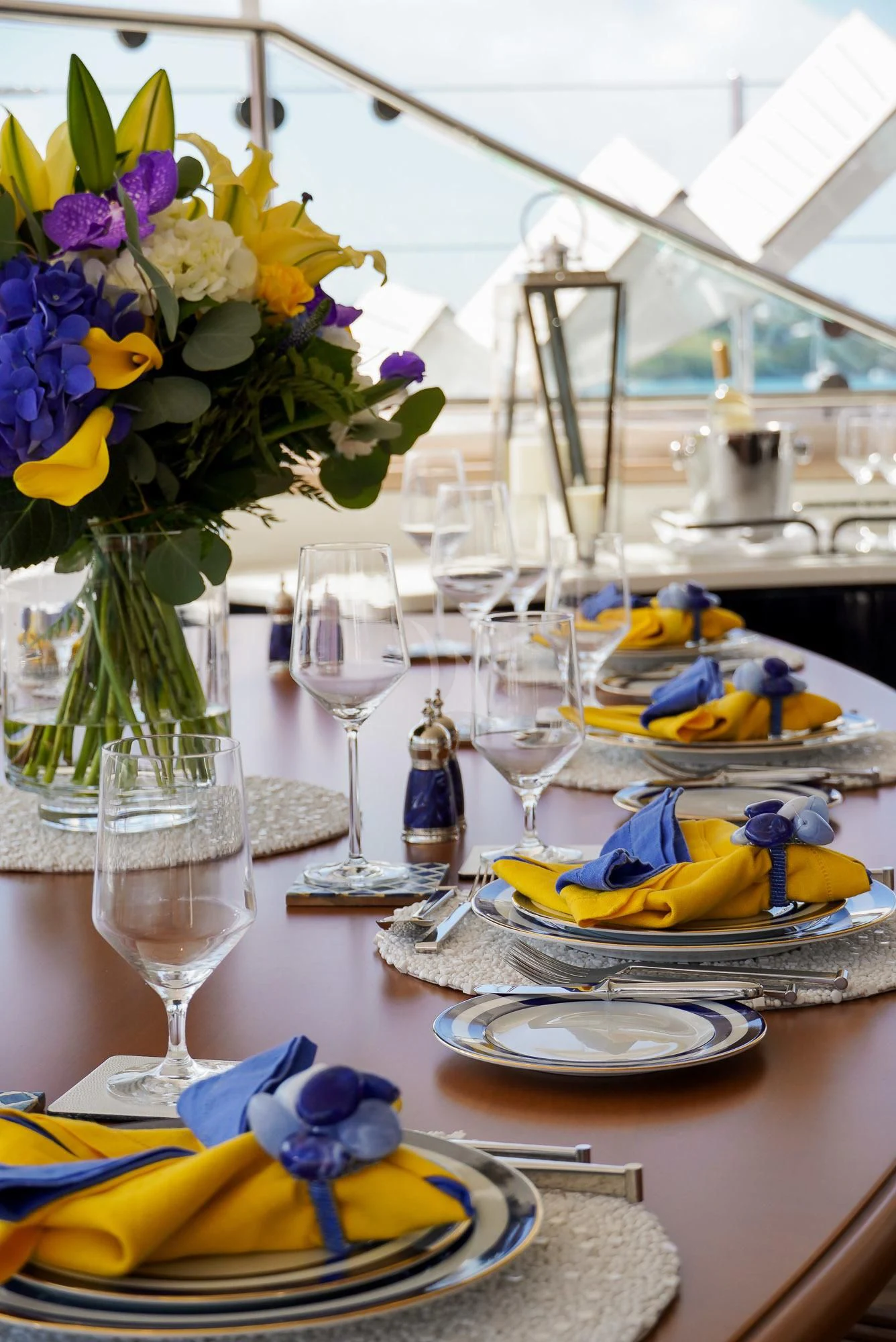 a table with plates and glasses aboard ZENJI Yacht for Sale