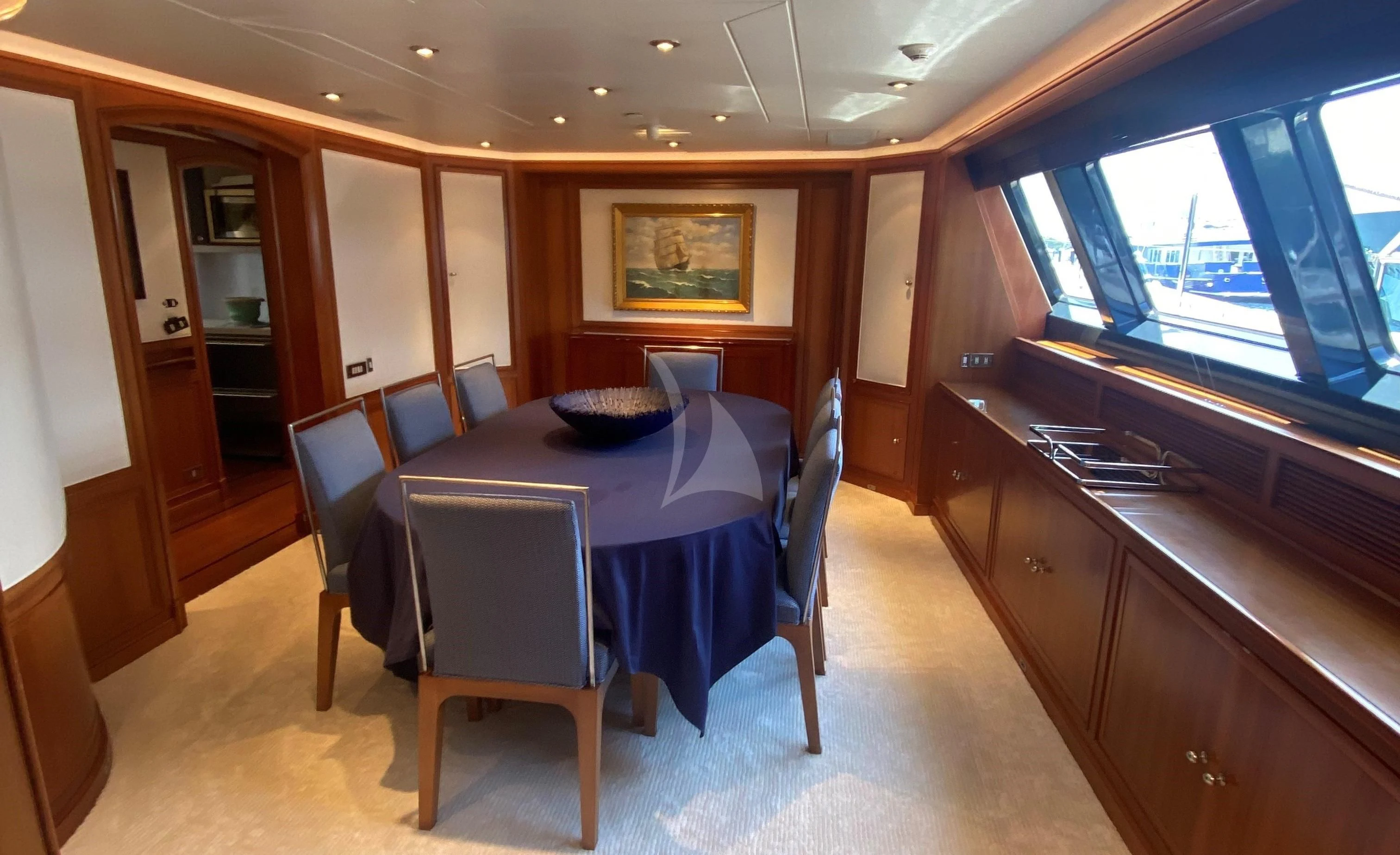 a room with a table and chairs aboard ZENJI Yacht for Sale