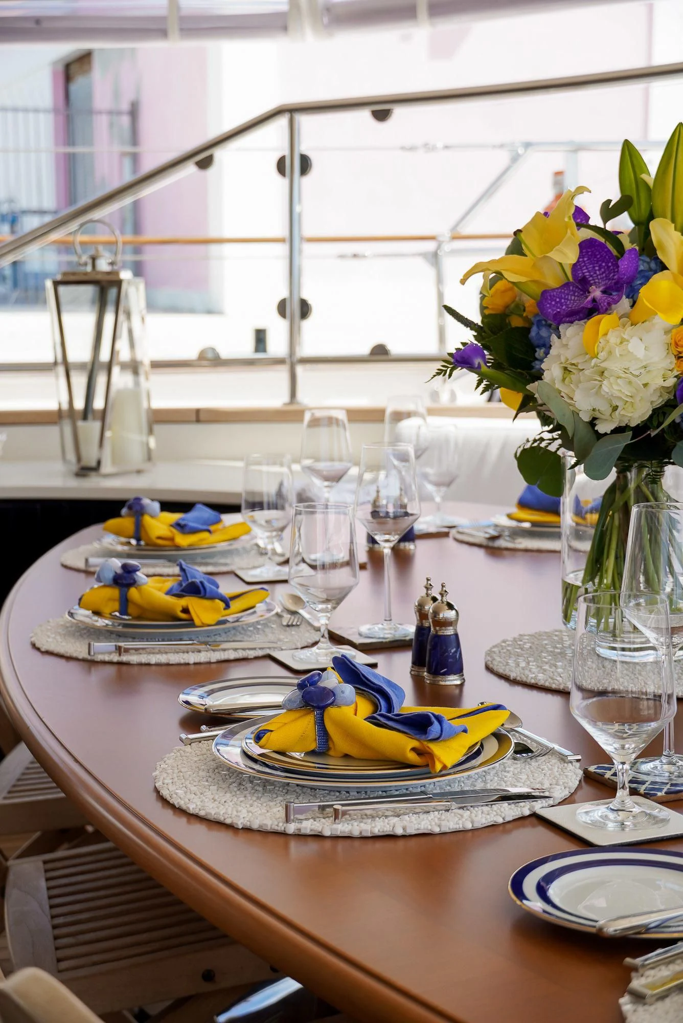 a table with plates and glasses aboard ZENJI Yacht for Sale