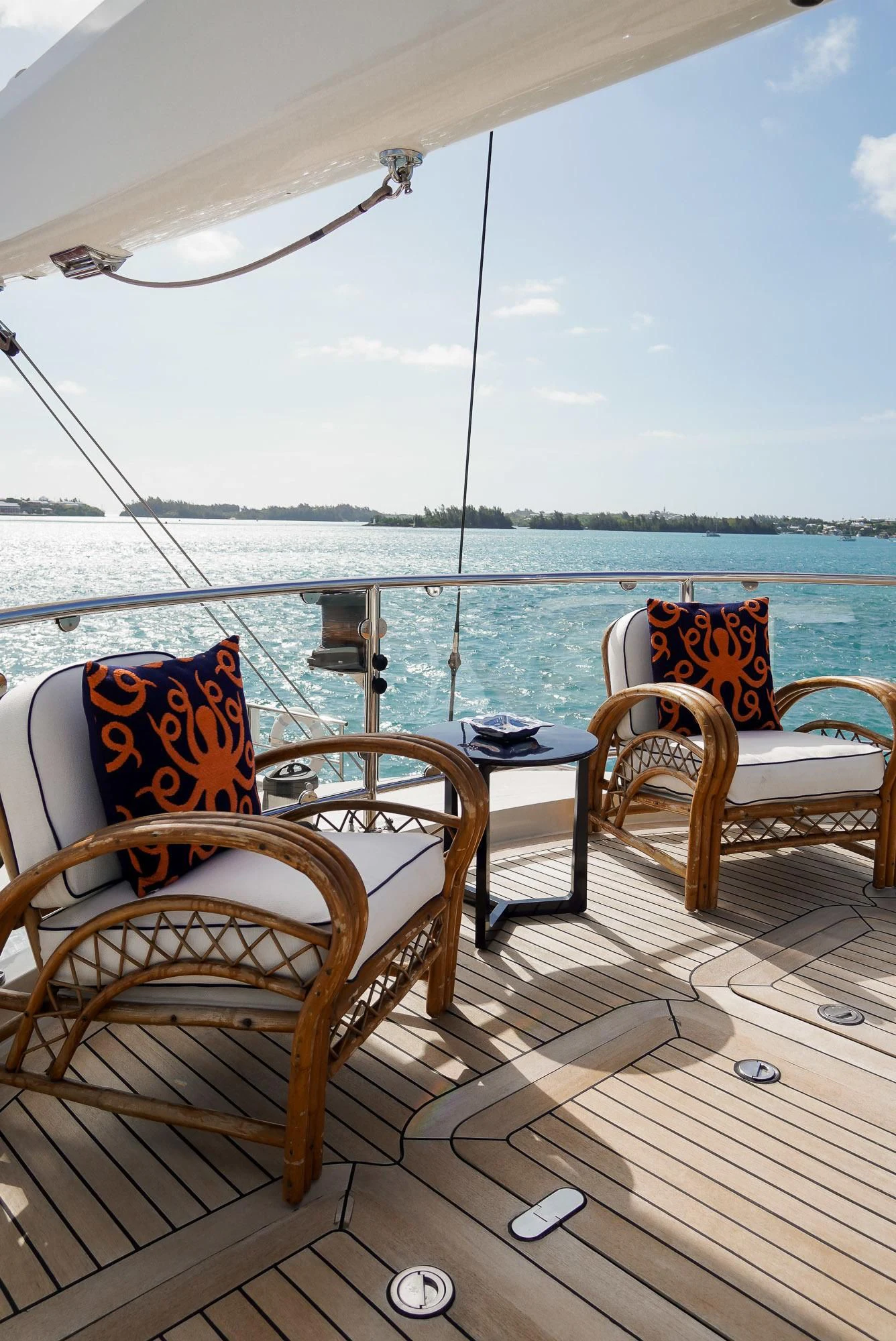 a deck with chairs and a table on it aboard ZENJI Yacht for Sale