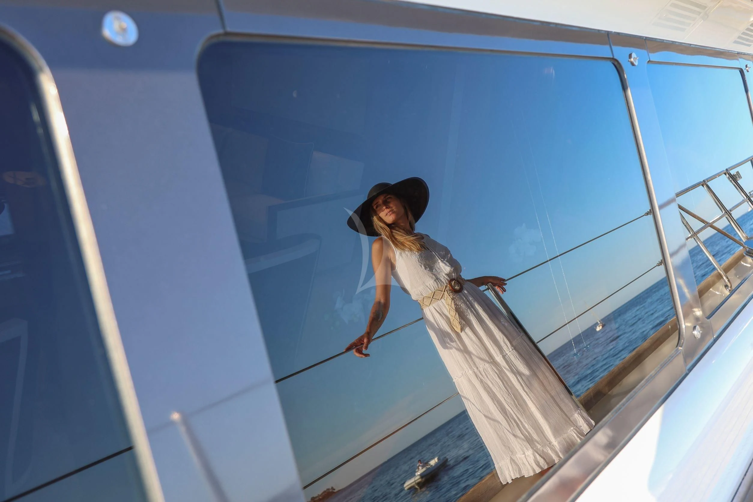 a person in a white dress aboard ZENJI Yacht for Sale