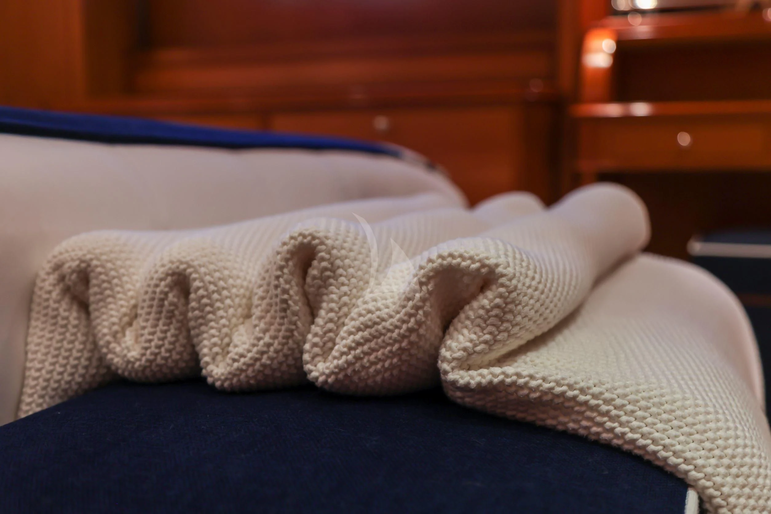 a towel on a bed aboard ZENJI Yacht for Sale