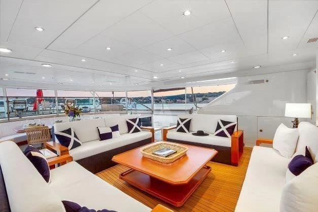 a room with a couch and a table aboard ZENJI Yacht for Sale