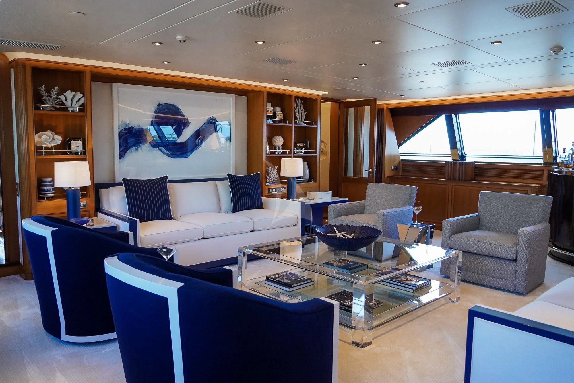 a living room with a large screen aboard ZENJI Yacht for Sale