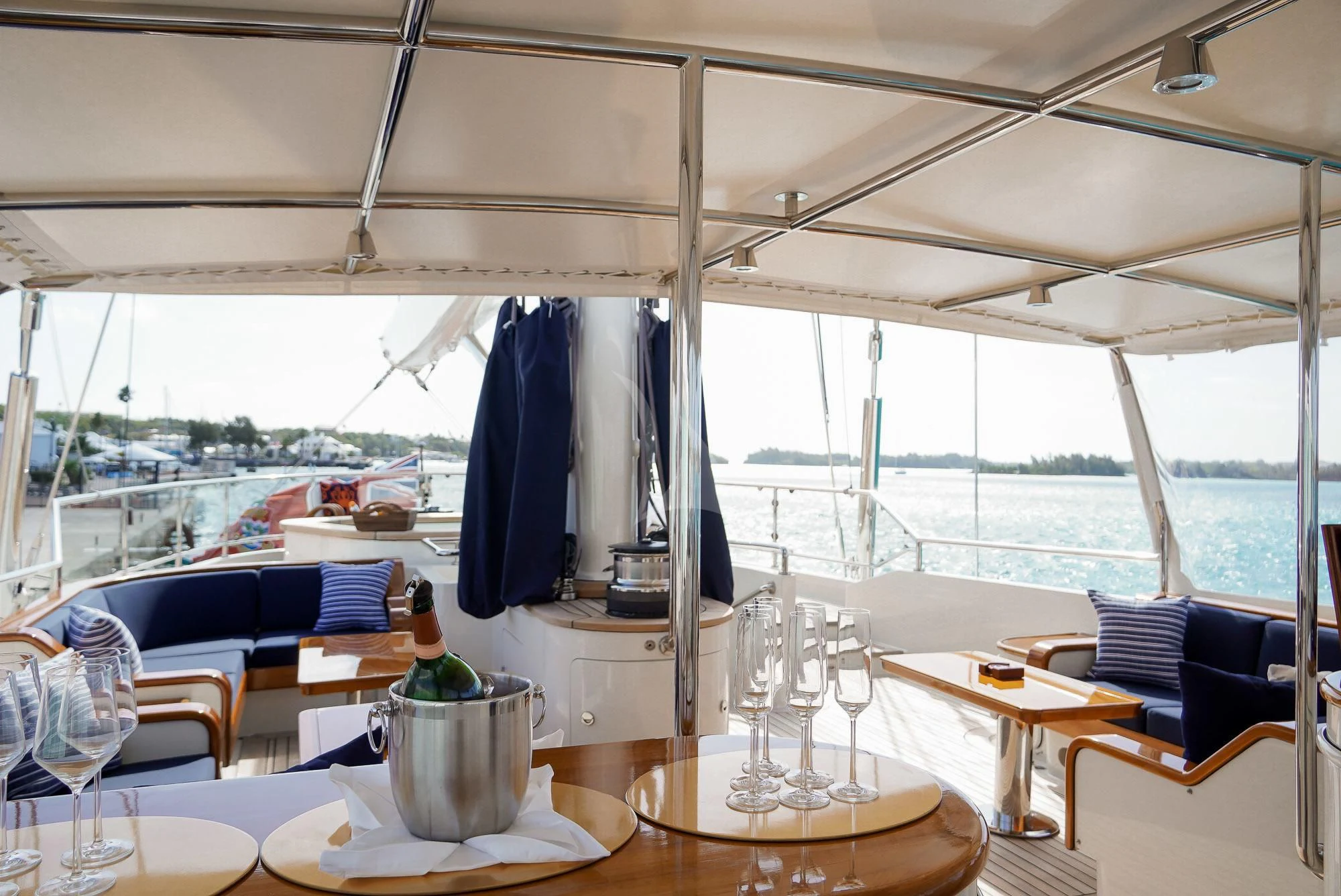 a table with chairs and a view of a city aboard ZENJI Yacht for Sale