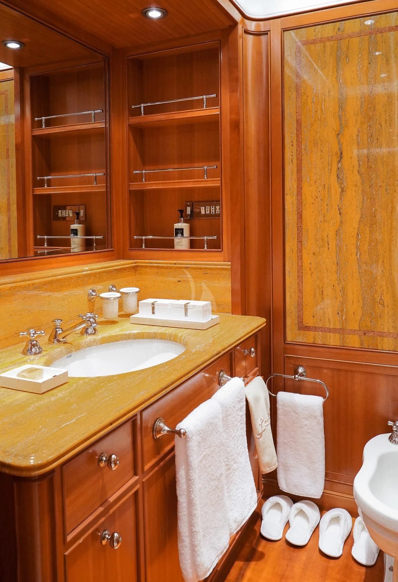 a bathroom with wooden cabinets aboard ZENJI Yacht for Sale