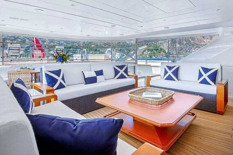 a room with a table and chairs aboard ZENJI Yacht for Sale