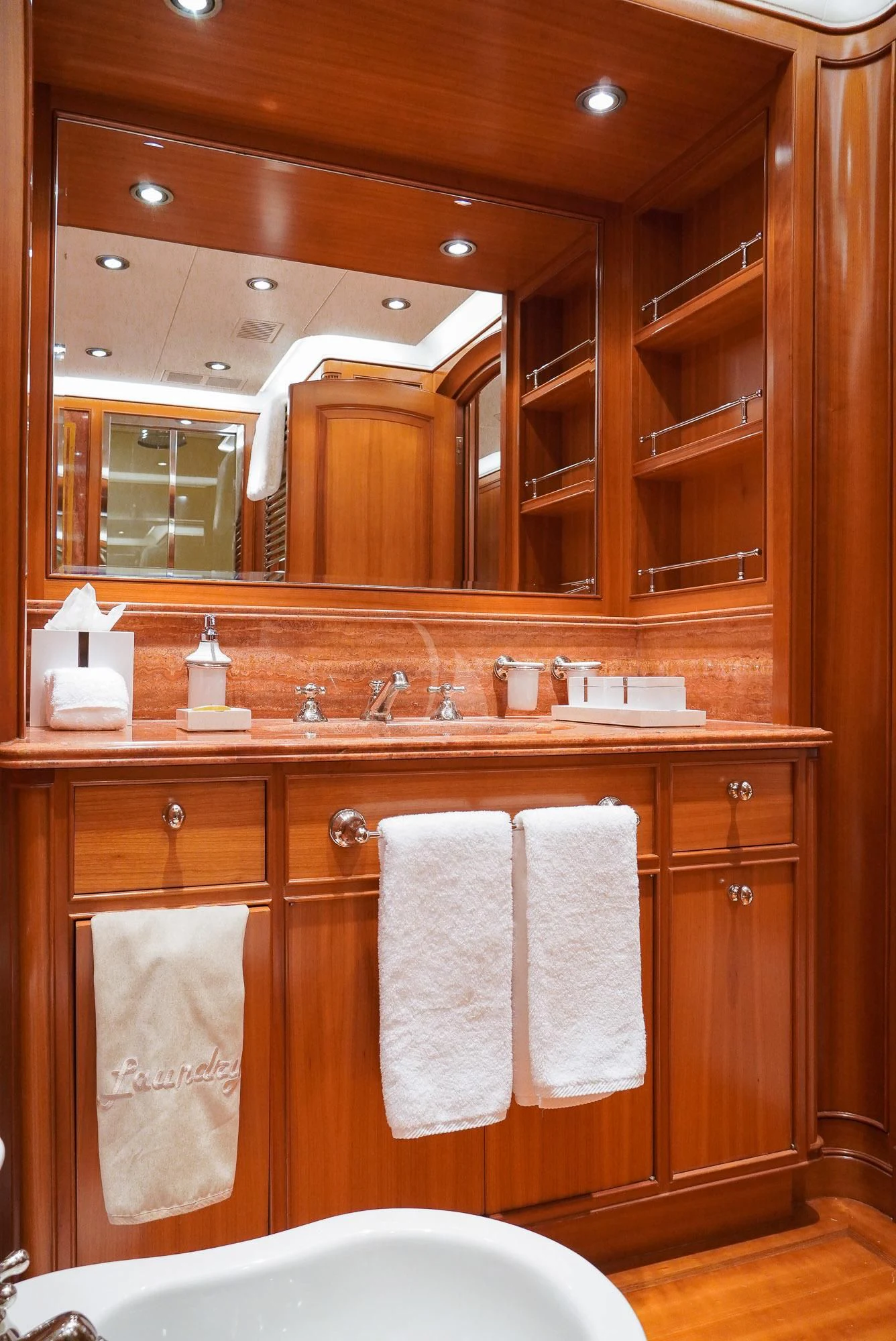 a bathroom with a large mirror aboard ZENJI Yacht for Sale