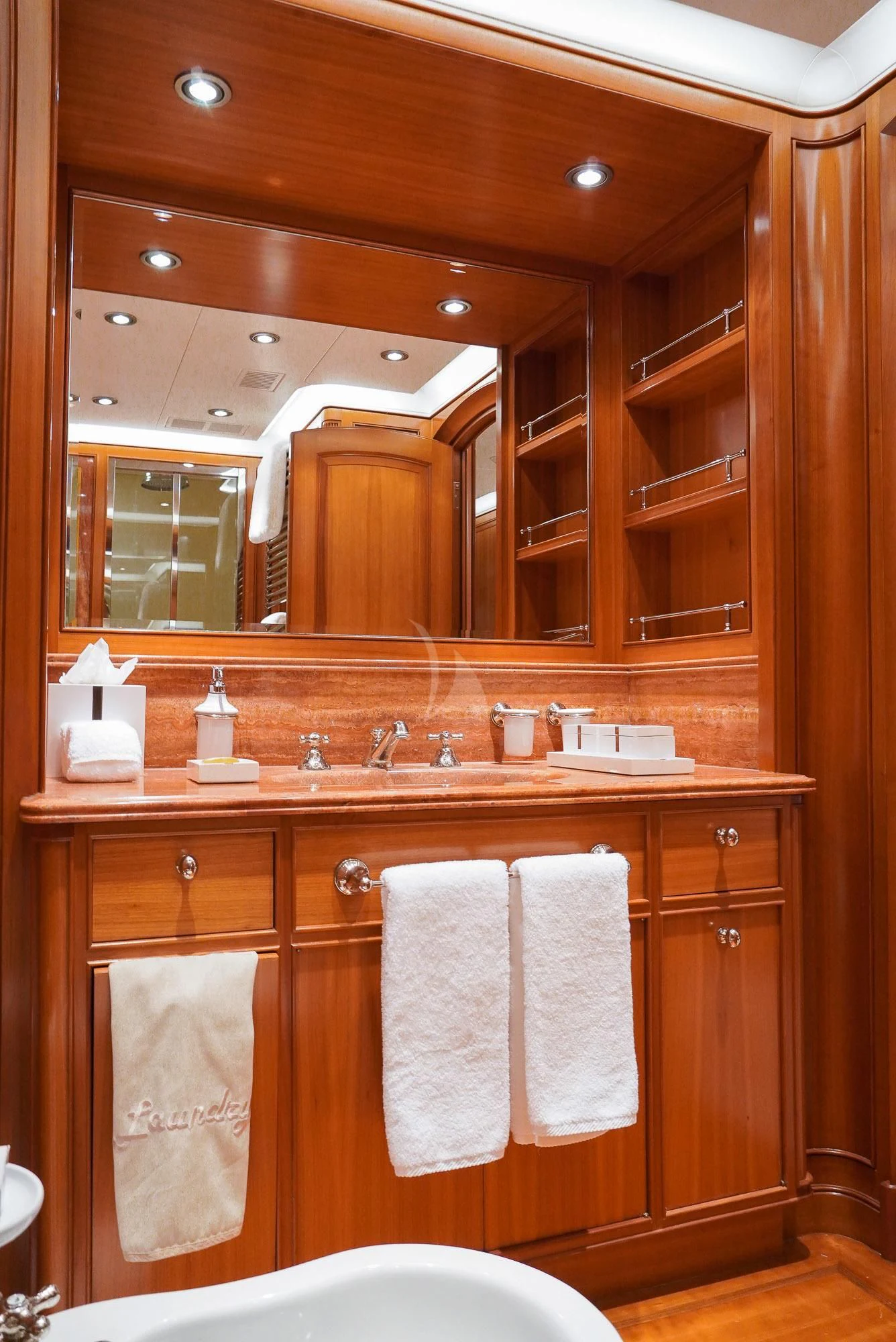 a bathroom with a large mirror aboard ZENJI Yacht for Sale