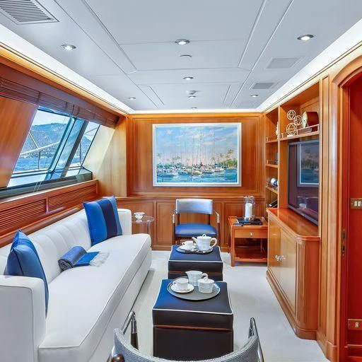 a room with a couch and a television aboard ZENJI Yacht for Sale