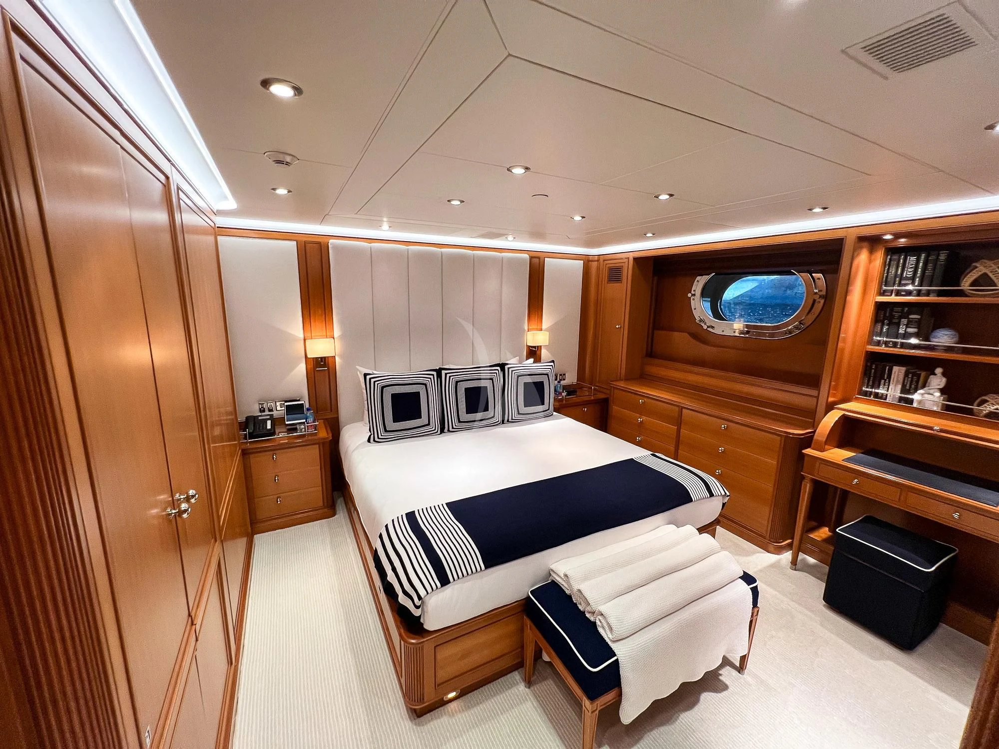 a room with a bed and a desk aboard ZENJI Yacht for Sale