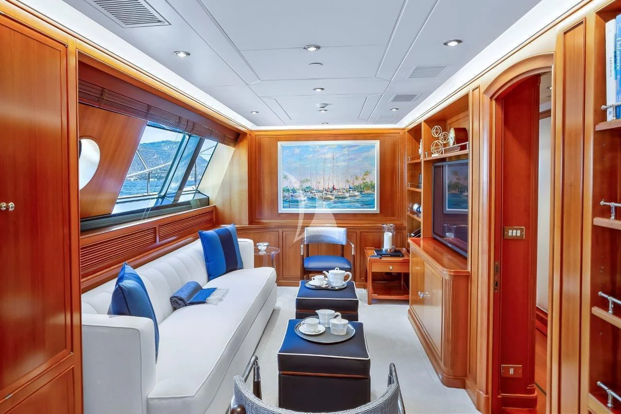 a room with a couch and a television aboard ZENJI Yacht for Sale