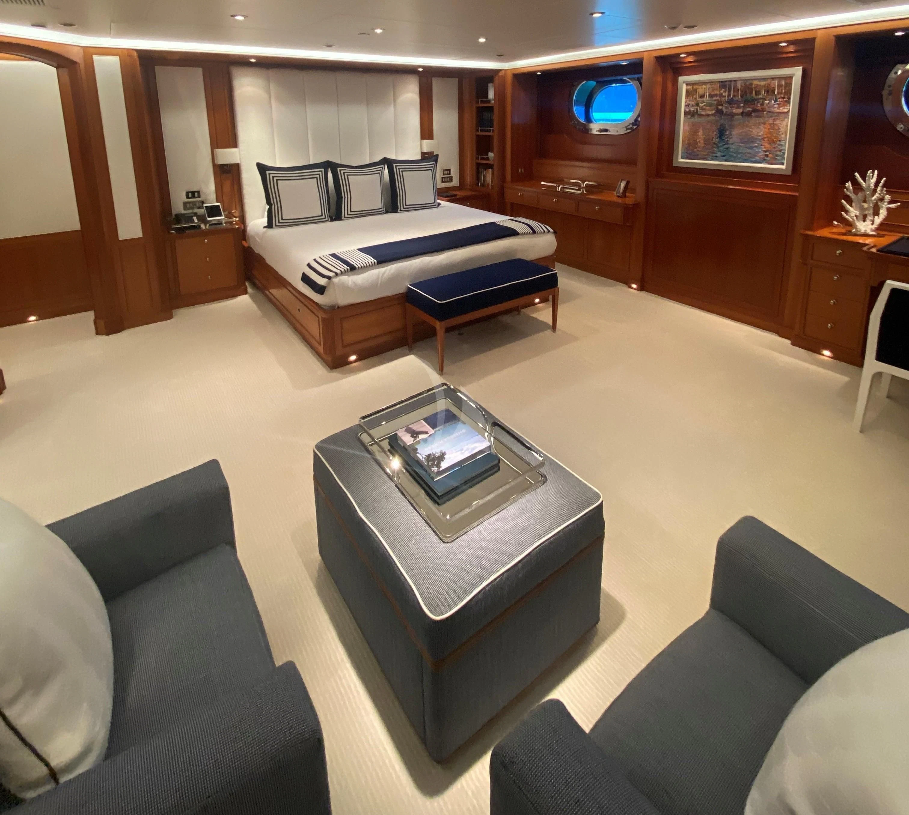a living room with a couch and a coffee table aboard ZENJI Yacht for Sale