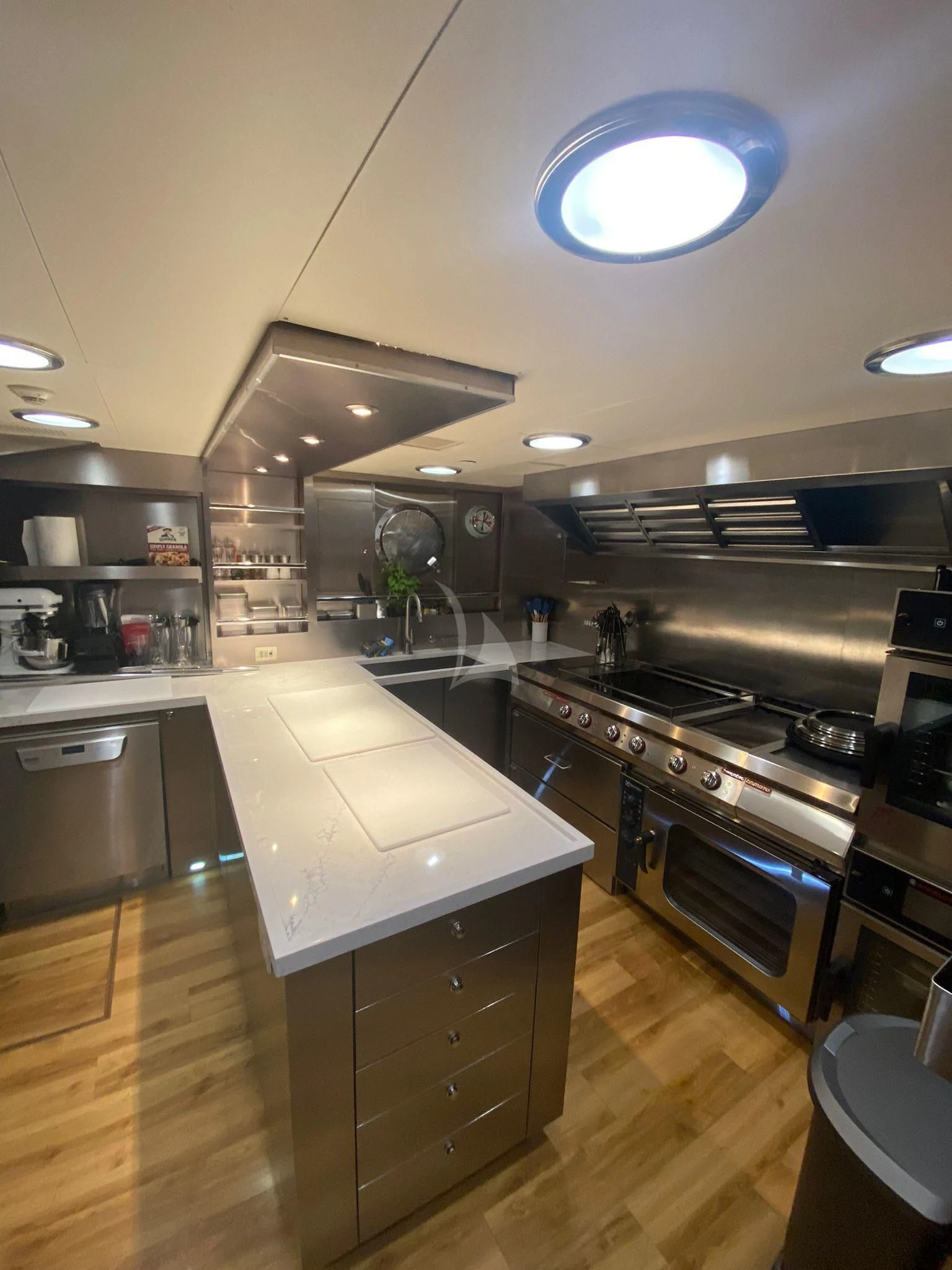 a kitchen with a large island aboard ZENJI Yacht for Sale