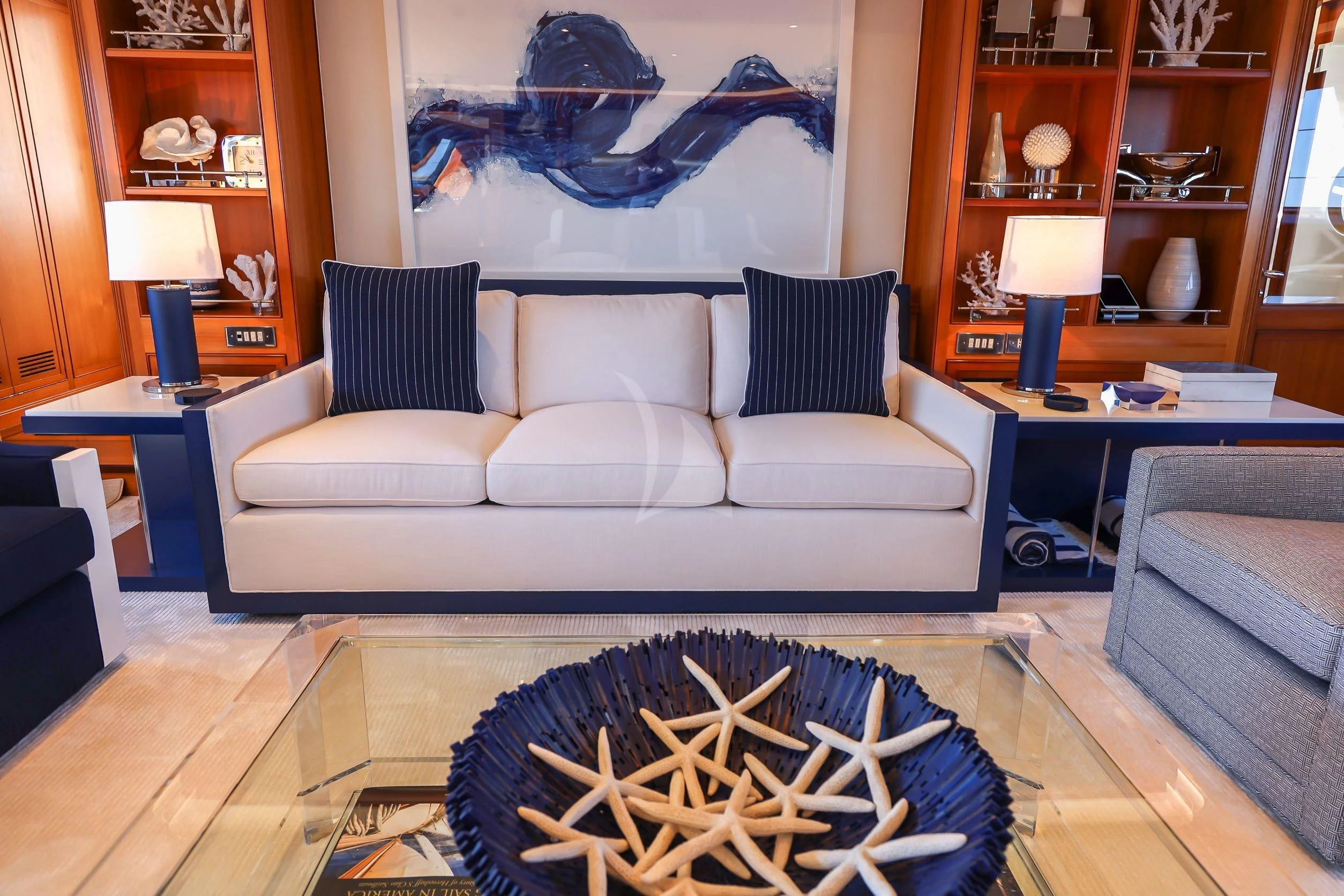 a living room with a white couch aboard ZENJI Yacht for Sale