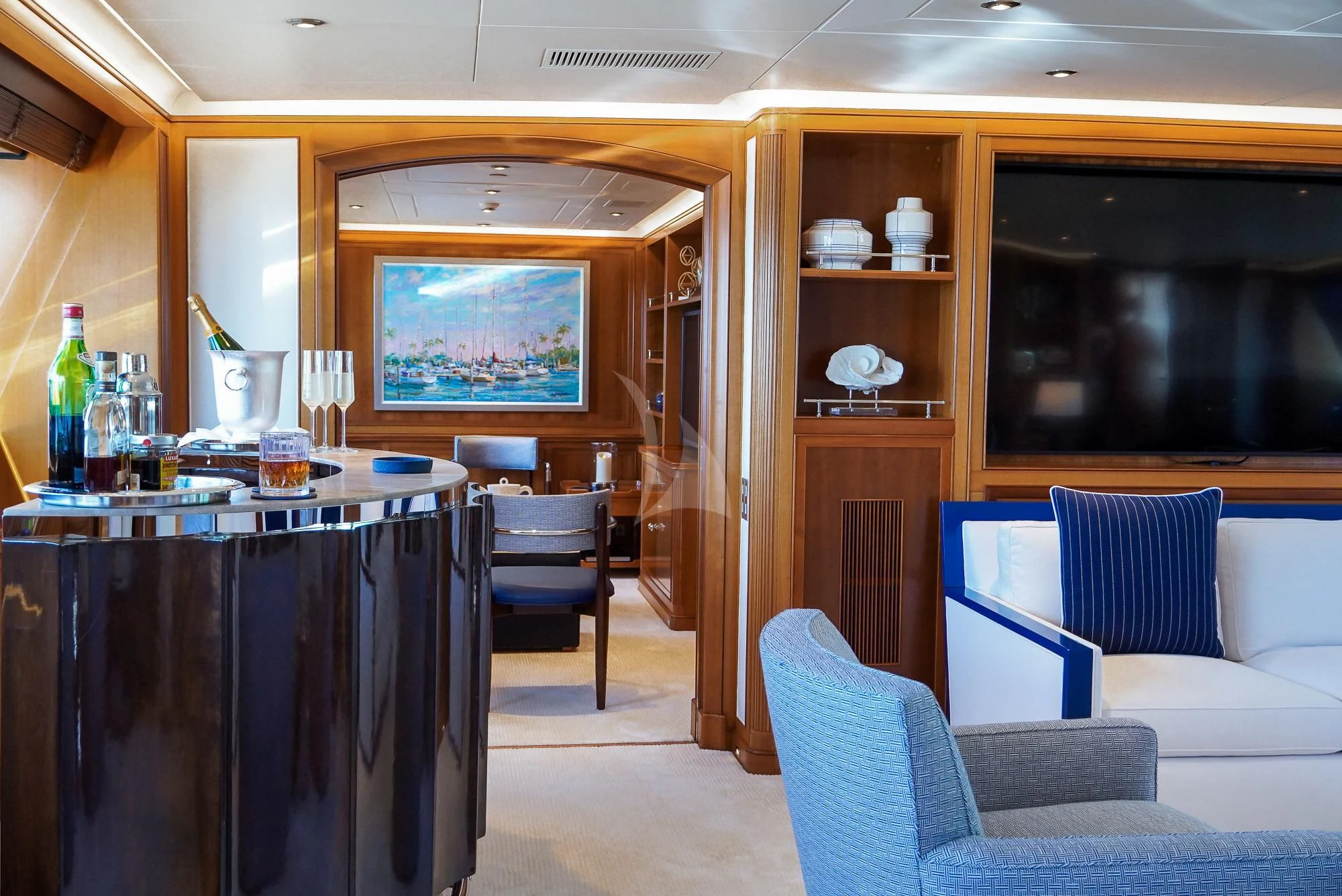 a room with a table chairs and a television aboard ZENJI Yacht for Sale