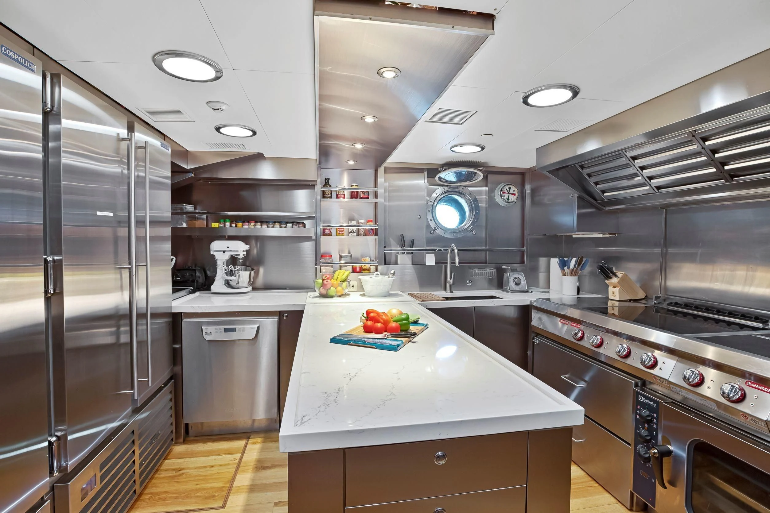 a kitchen with stainless steel appliances aboard ZENJI Yacht for Sale