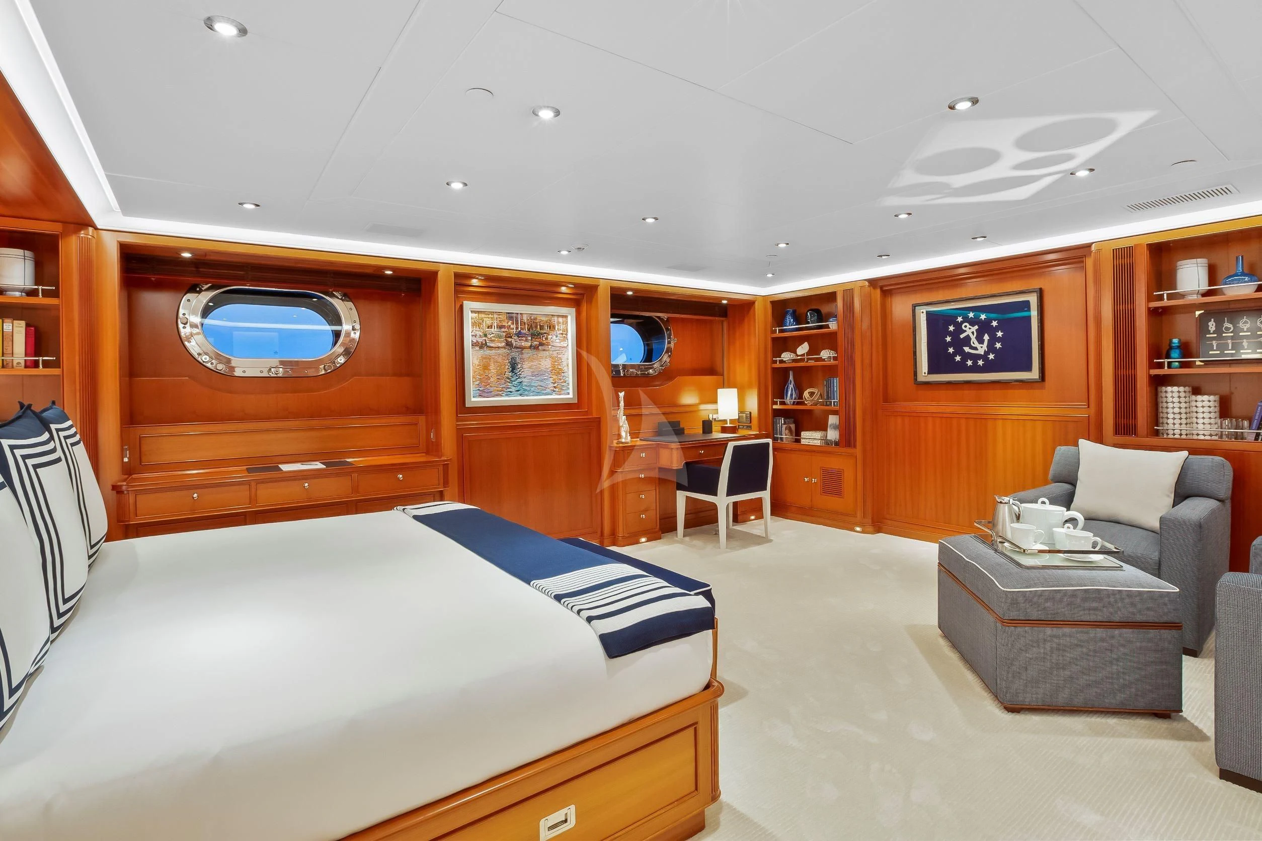 a room with a bed and a couch aboard ZENJI Yacht for Sale
