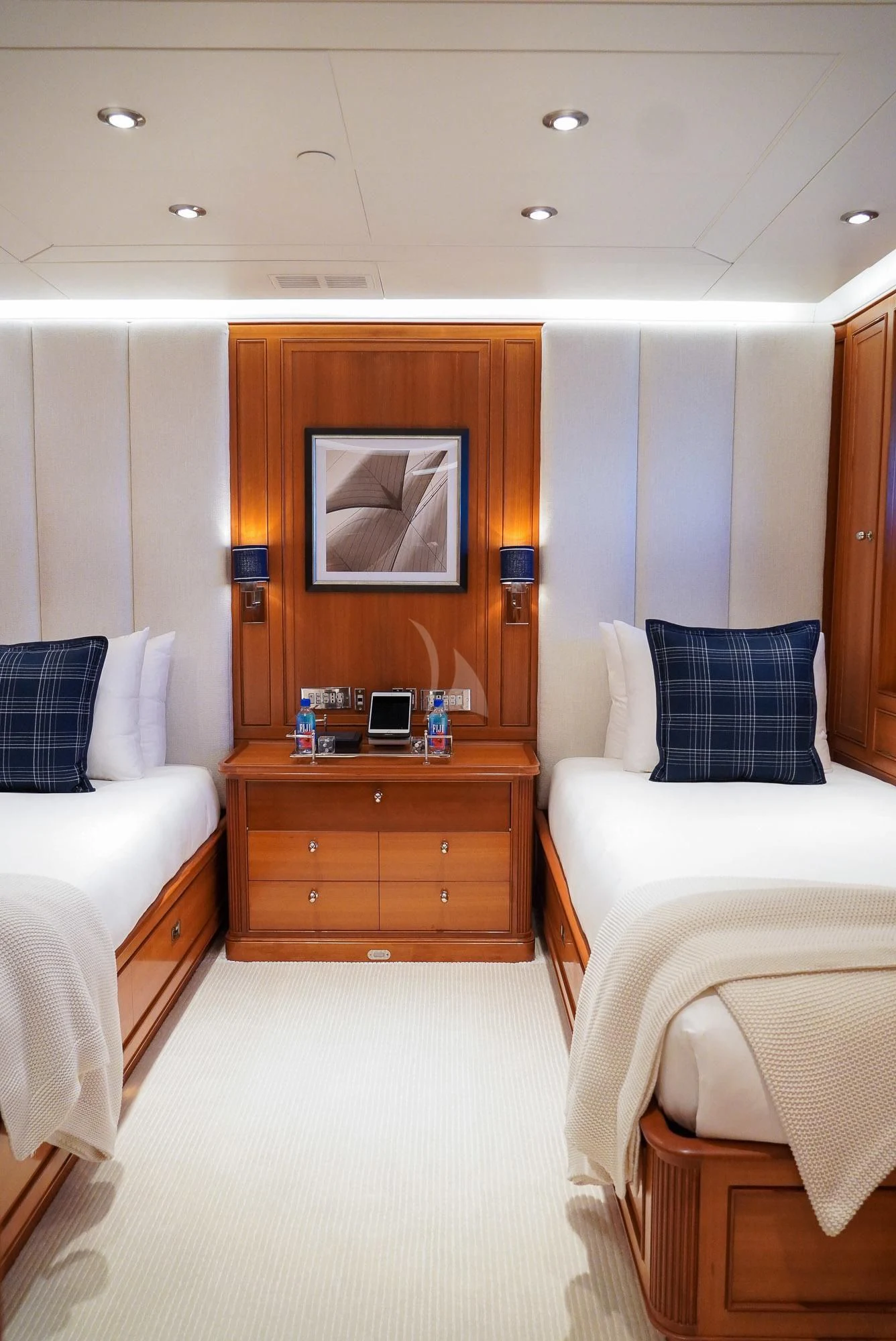 a bedroom with a bed and a desk aboard ZENJI Yacht for Sale