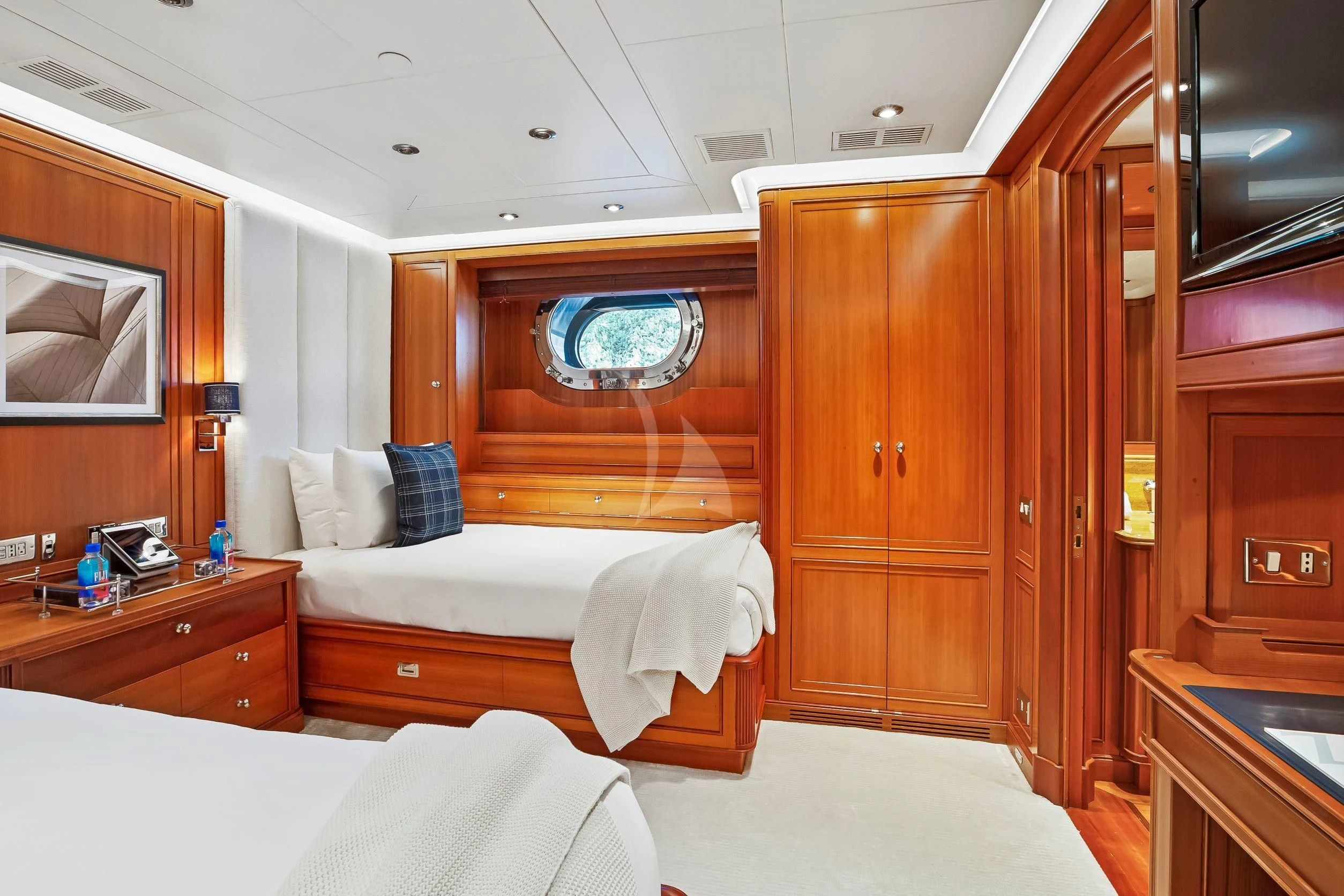 a room with a bed and a closet aboard ZENJI Yacht for Sale