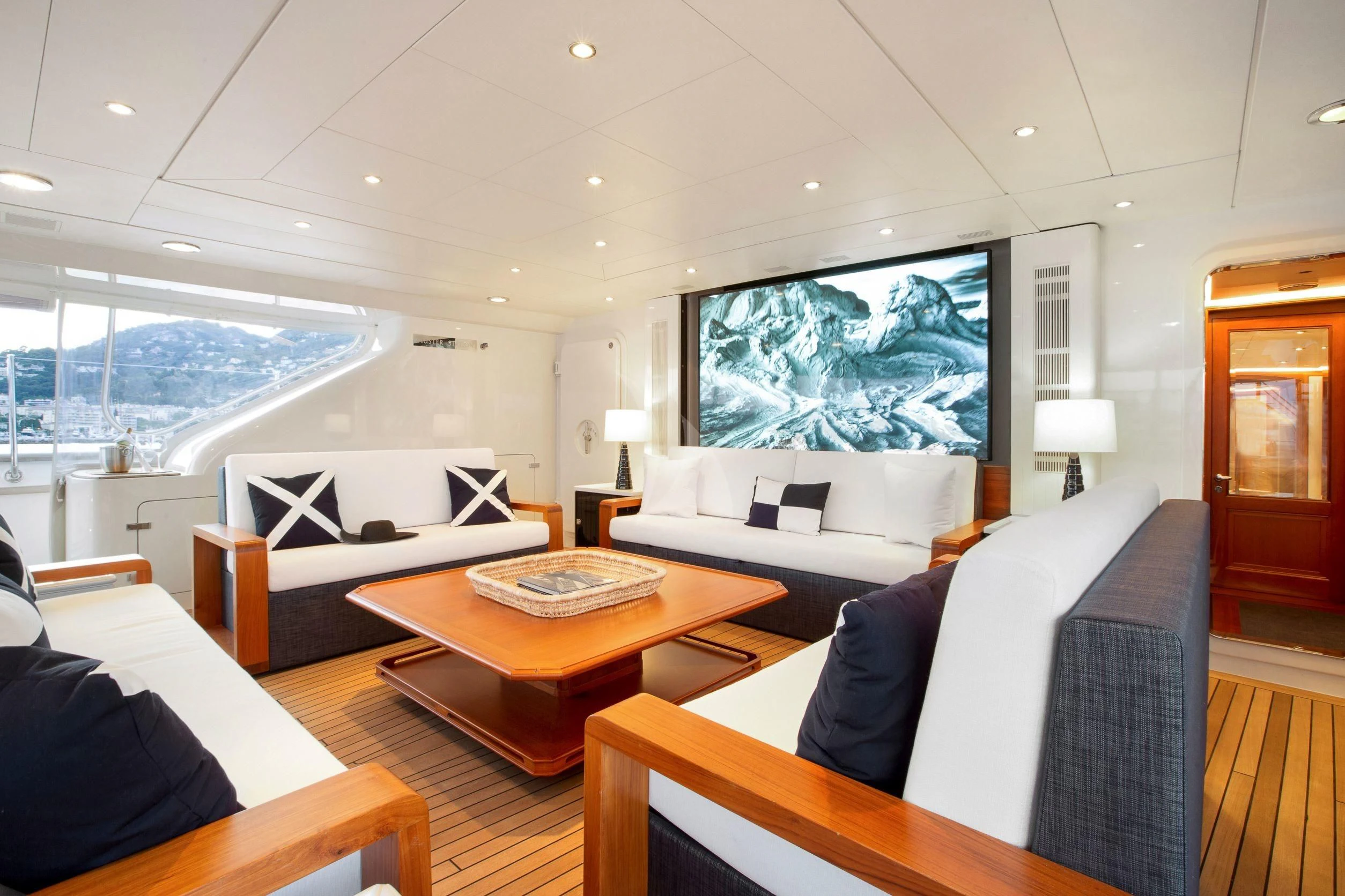 a living room with a large screen aboard ZENJI Yacht for Sale