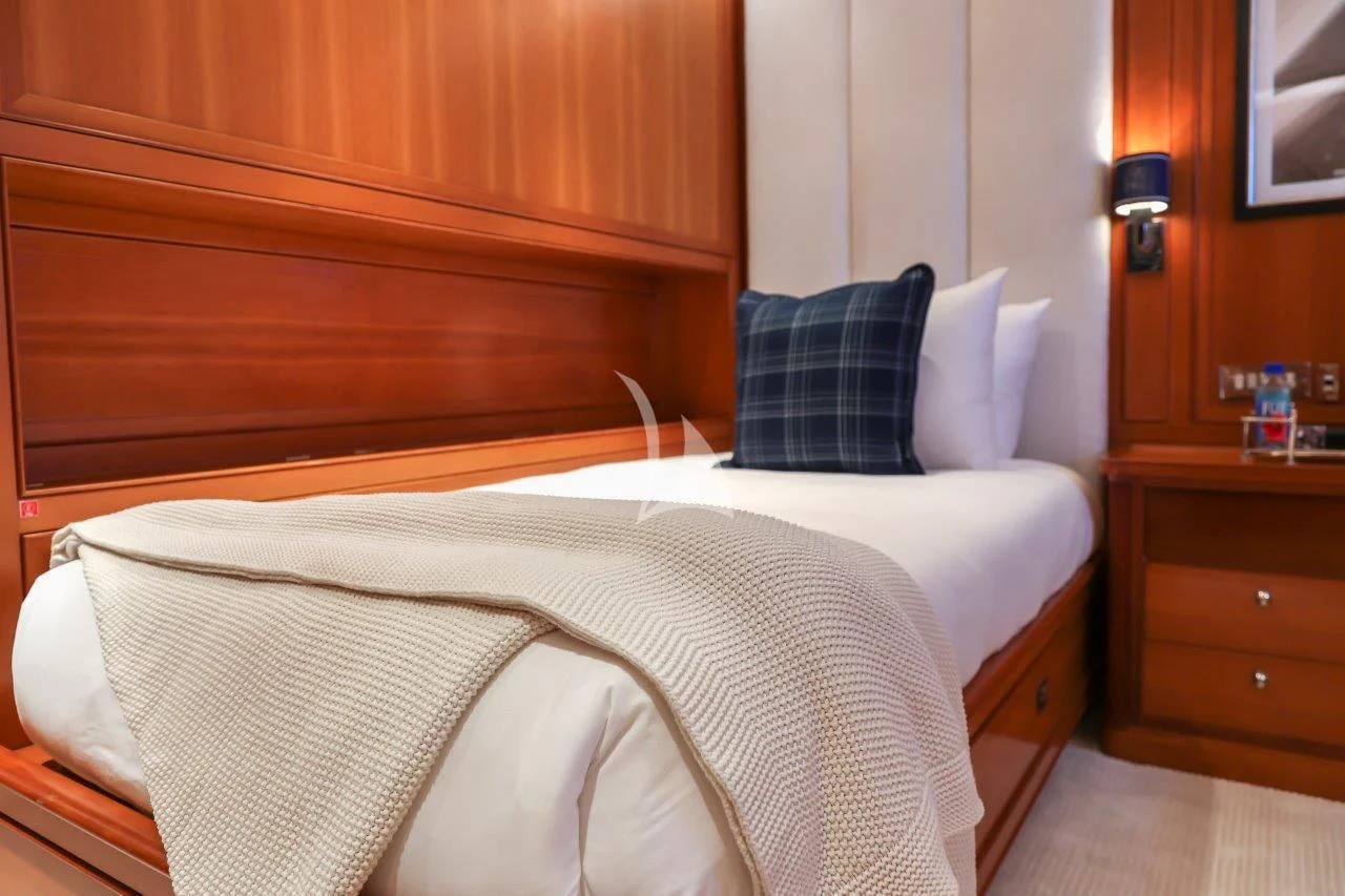 a bed with a white sheet aboard ZENJI Yacht for Sale
