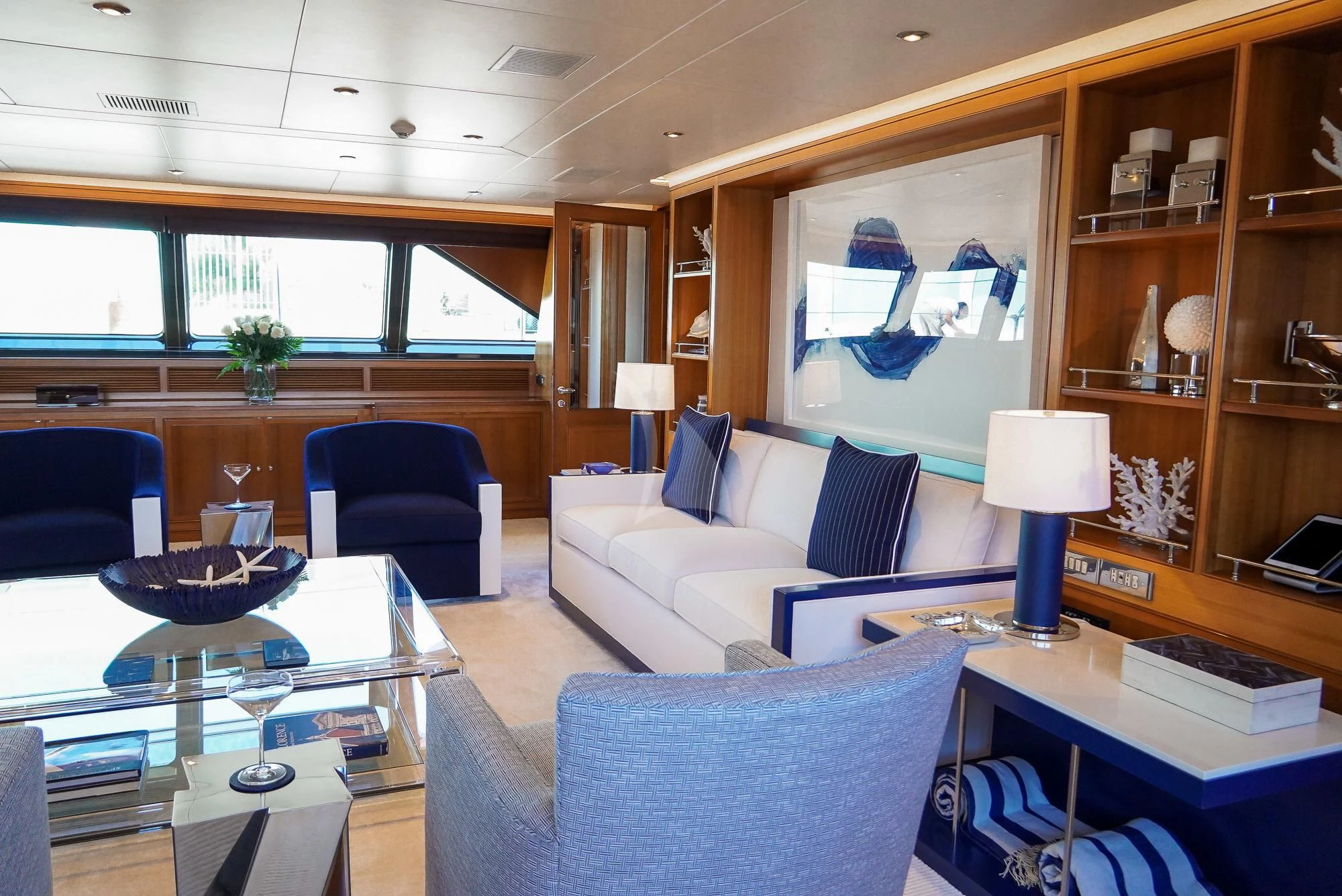 a living room with a couch and a table aboard ZENJI Yacht for Sale
