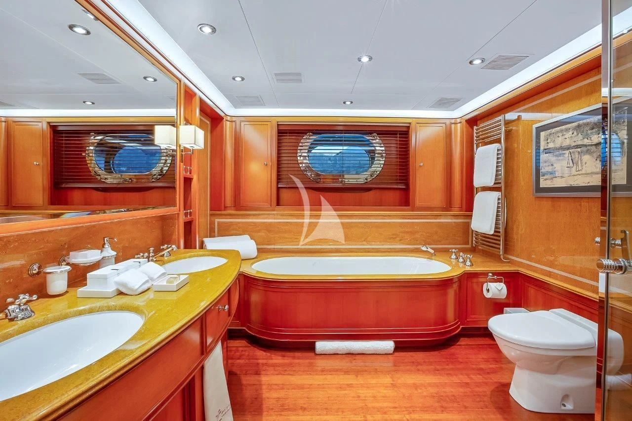 a bathroom with a tub sink and toilet aboard ZENJI Yacht for Sale