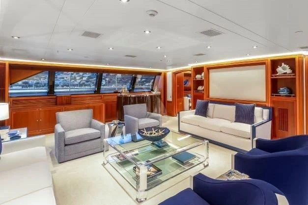 a living room with a couch and a coffee table aboard ZENJI Yacht for Sale