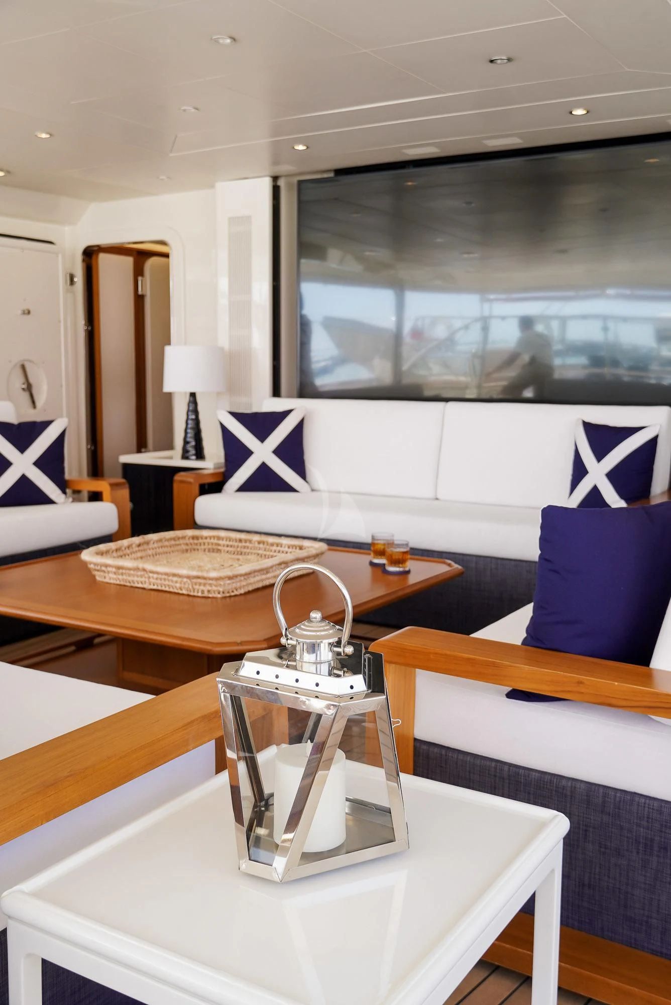 a room with a table and a lamp on a table aboard ZENJI Yacht for Sale