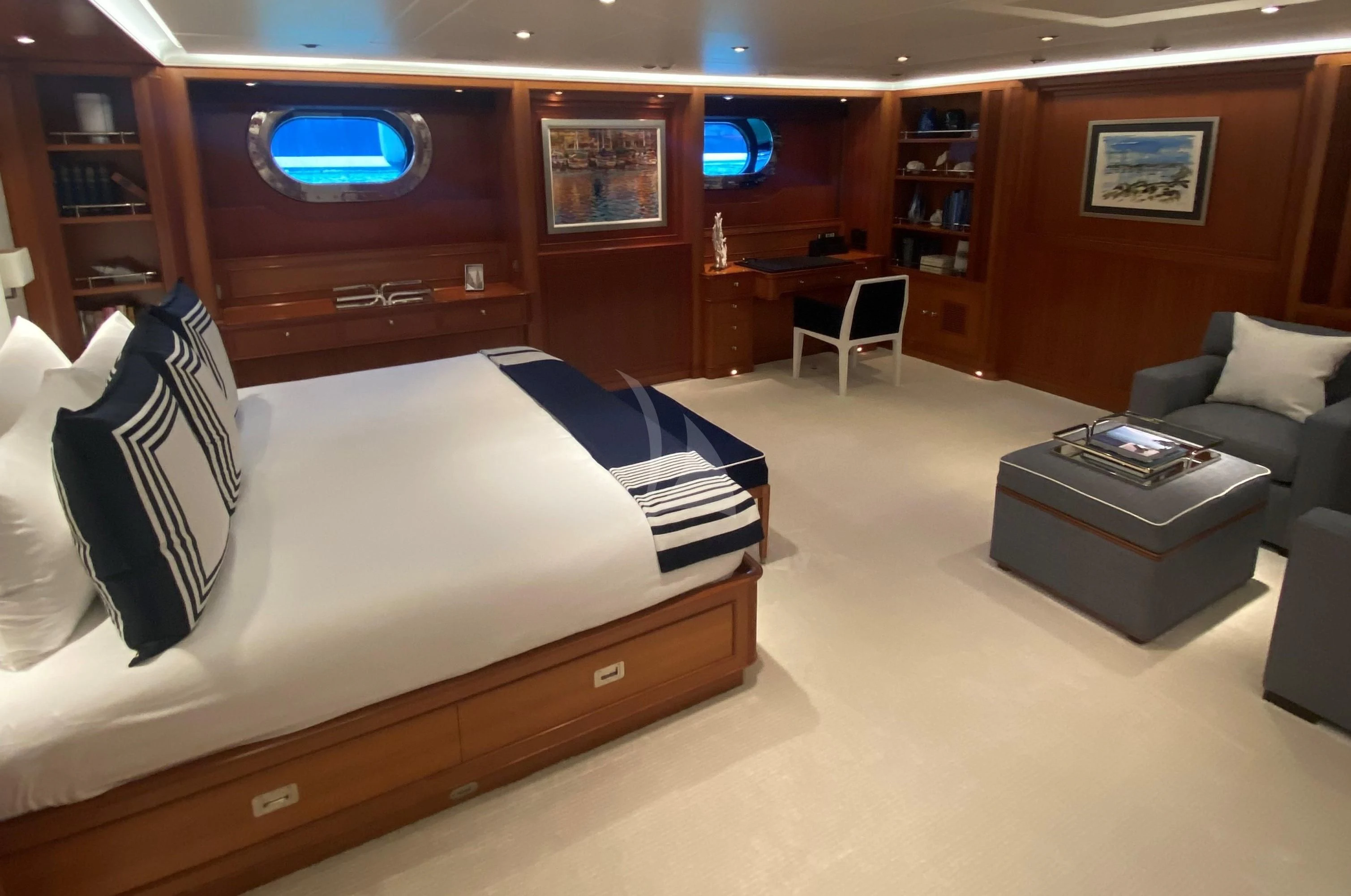 a room with a bed and a couch aboard ZENJI Yacht for Sale
