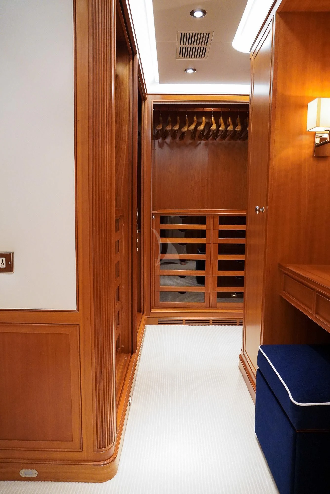 a room with a closet and a shelf with books on it aboard ZENJI Yacht for Sale