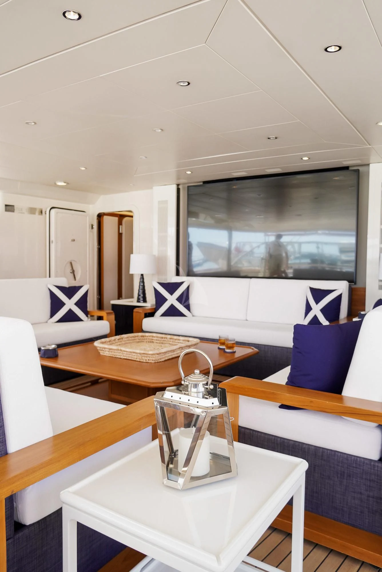 a room with a table and a couch aboard ZENJI Yacht for Sale