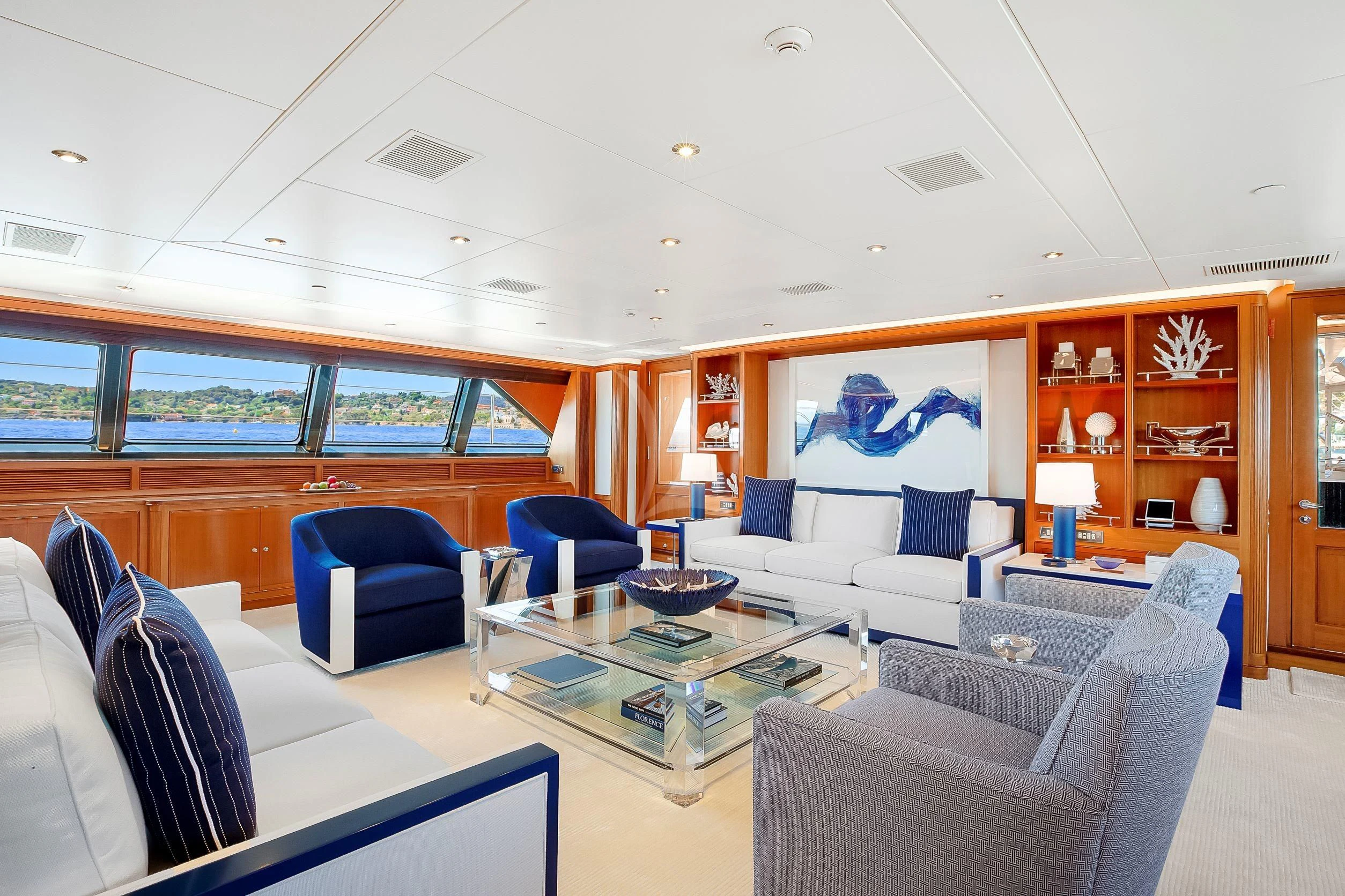 a room with a couch and a table aboard ZENJI Yacht for Sale