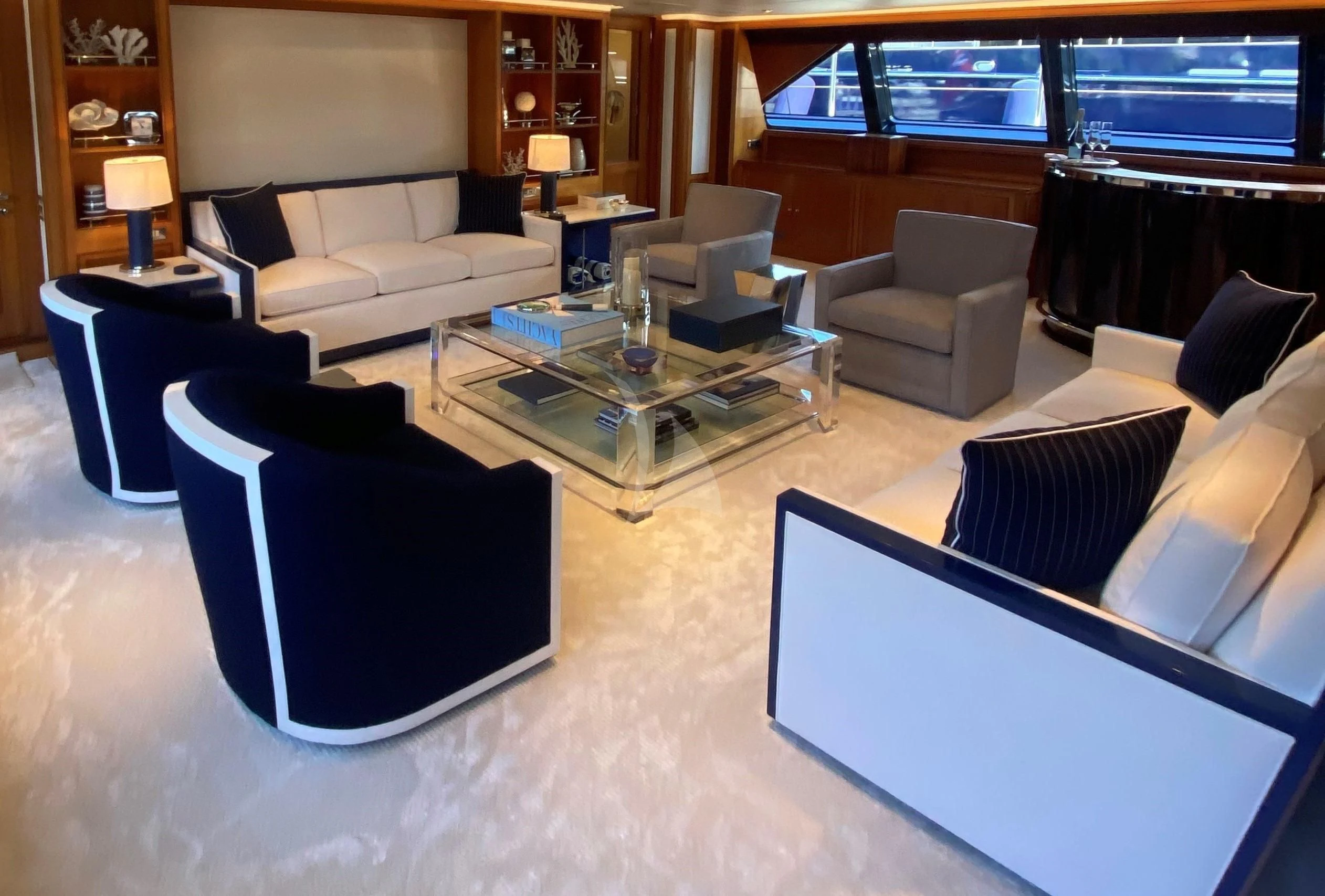 a living room with a couch and a coffee table aboard ZENJI Yacht for Sale