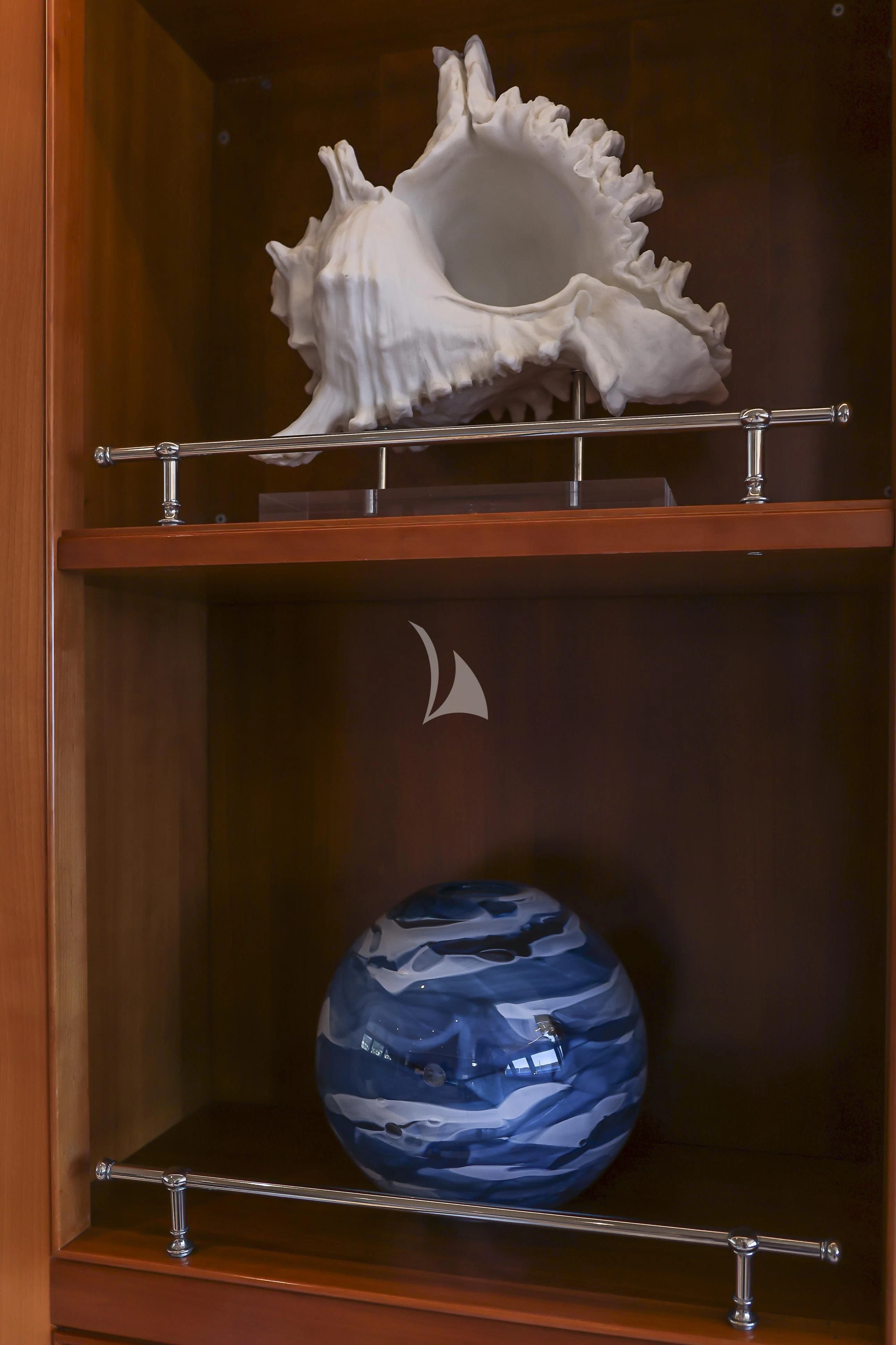a white and blue ball on a shelf aboard ZENJI Yacht for Sale