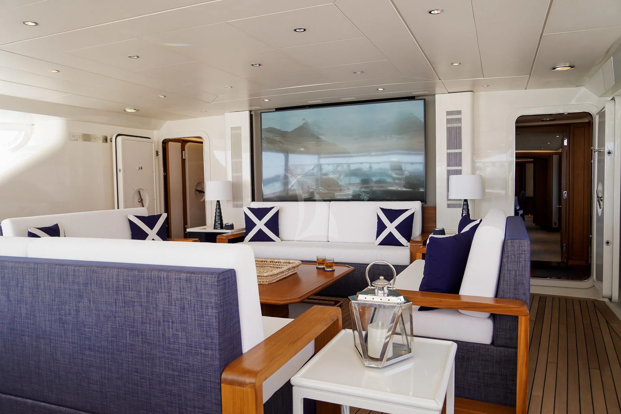 a living room with a large screen aboard ZENJI Yacht for Sale