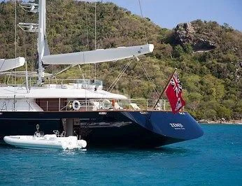 a boat with a flag on it aboard ZENJI Yacht for Sale
