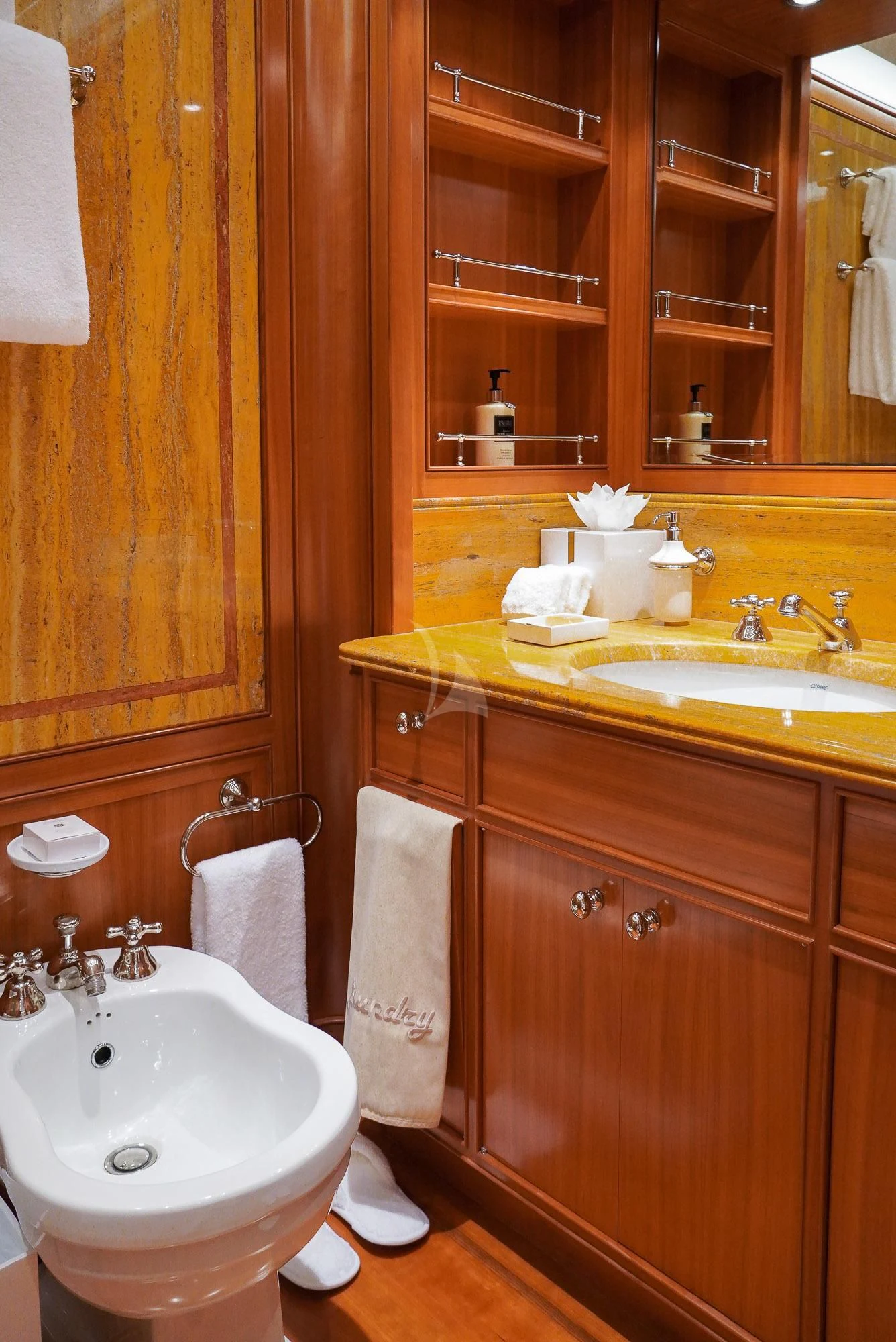 a bathroom with a sink and a mirror aboard ZENJI Yacht for Sale