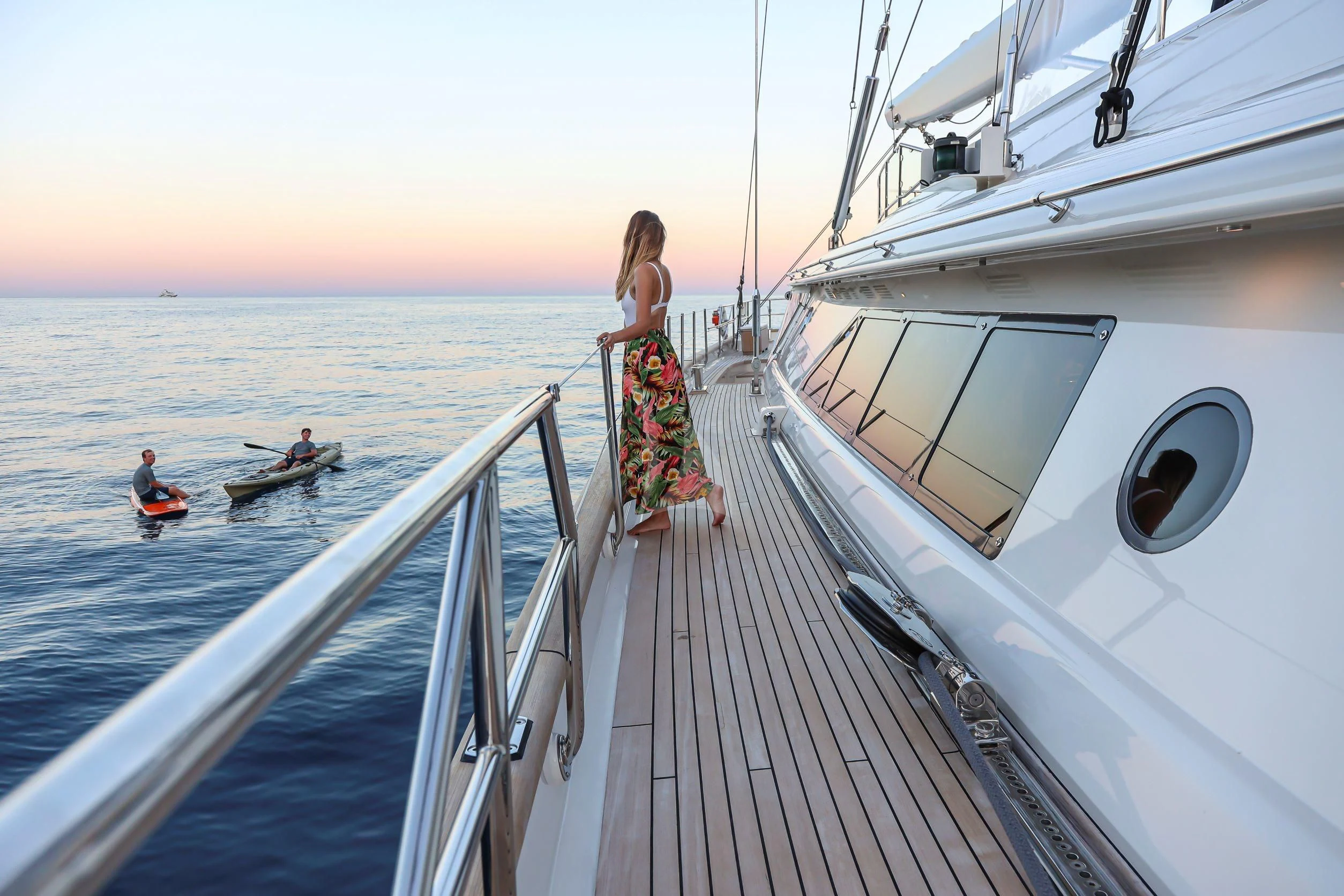 a person standing on a boat aboard ZENJI Yacht for Sale