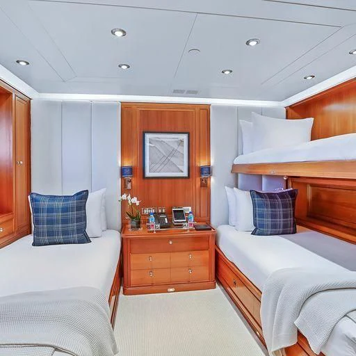 a room with a bed and a desk aboard ZENJI Yacht for Sale