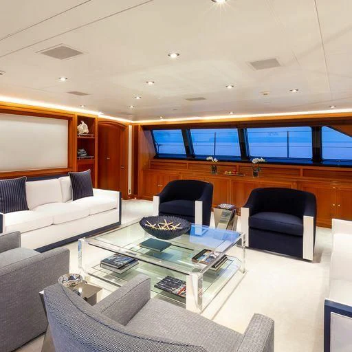 a living room with a table and chairs aboard ZENJI Yacht for Sale
