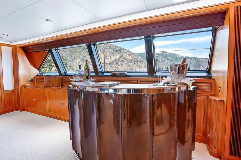 a wooden kitchen with a large window aboard ZENJI Yacht for Sale