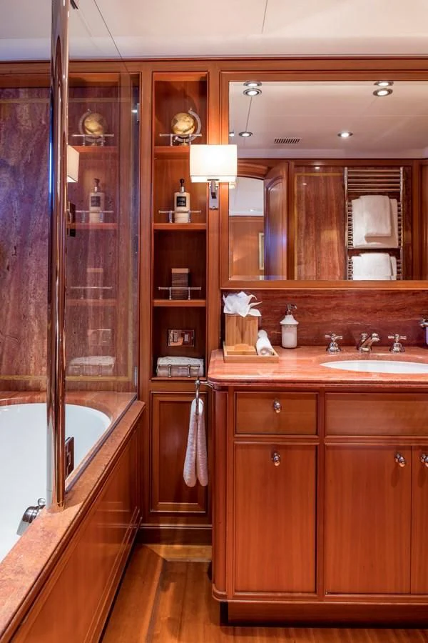 a bathroom with a glass shower aboard ZENJI Yacht for Sale