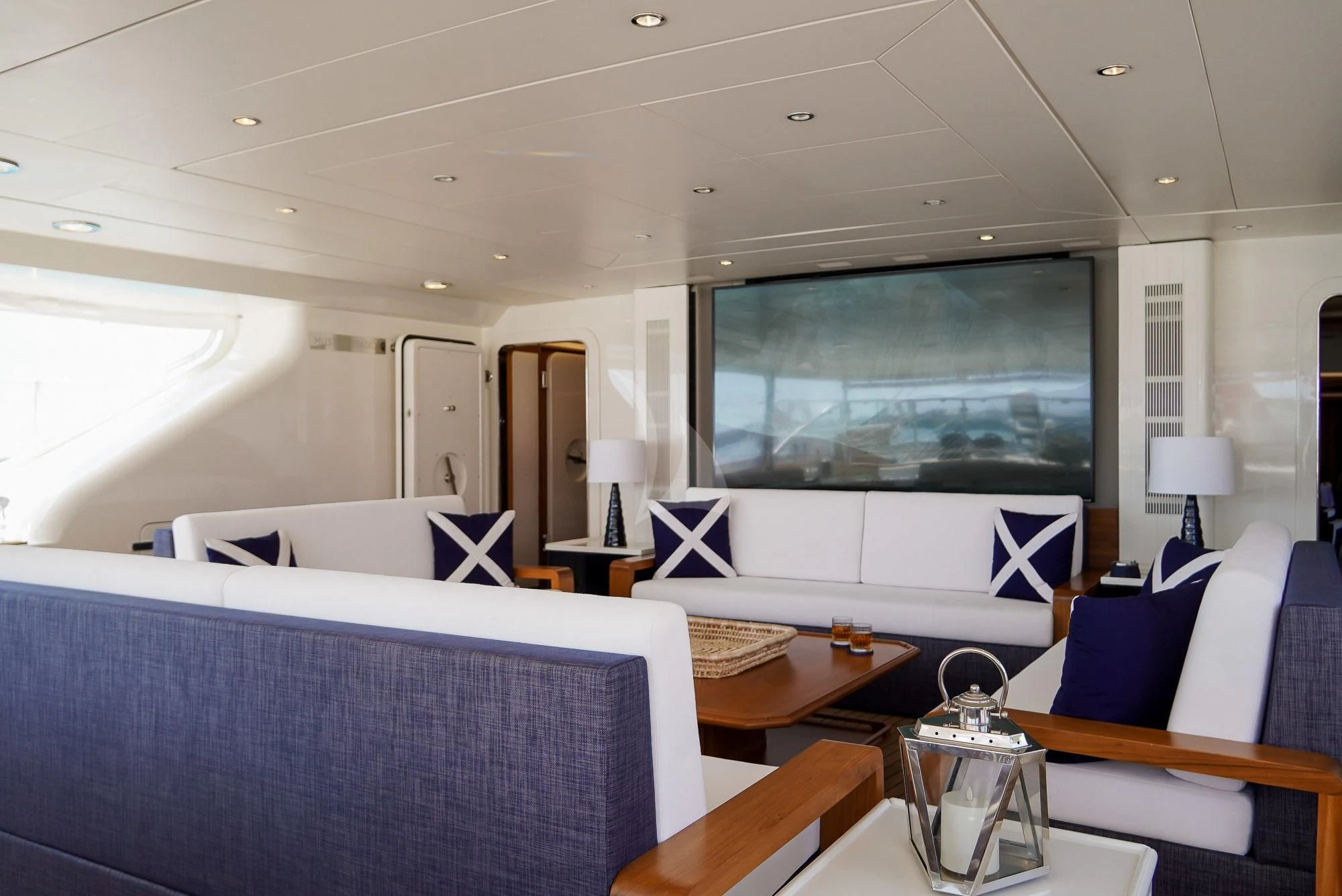 a room with a couch and a television aboard ZENJI Yacht for Sale