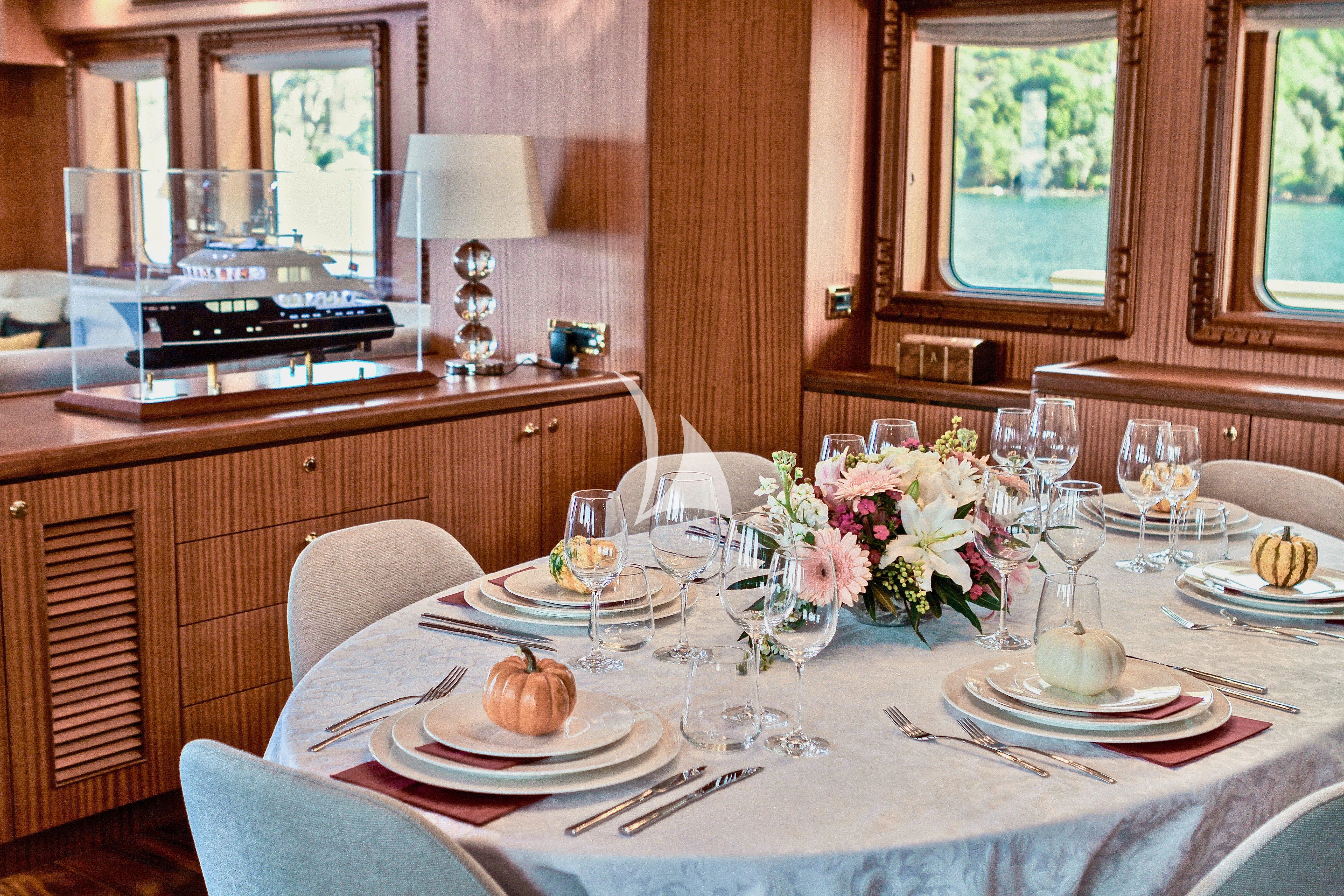 a table with plates and glasses aboard BALTIC SEA Yacht for Sale