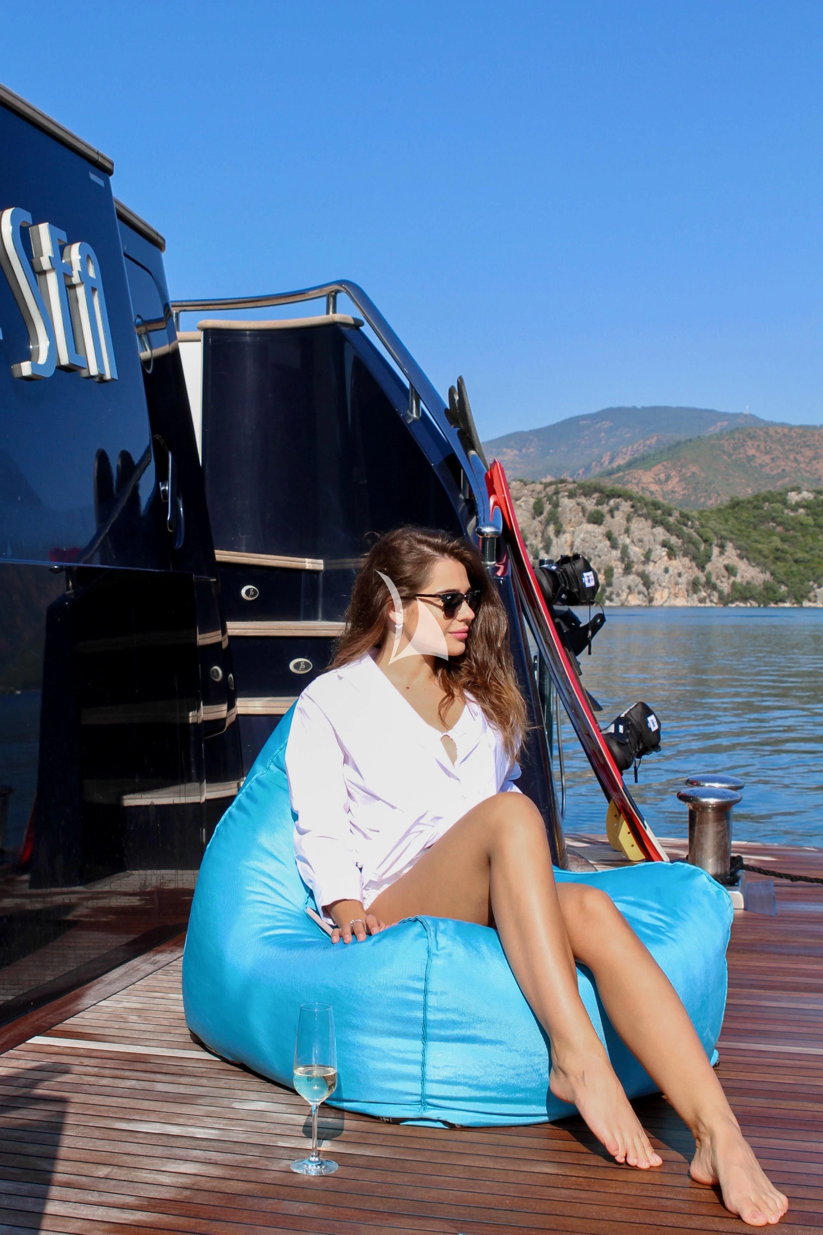 a woman sitting on a boat aboard BALTIC SEA Yacht for Sale