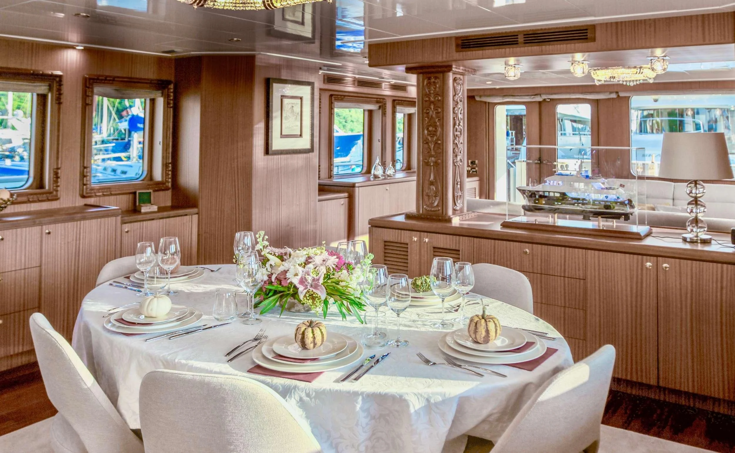 a dining room with a table set for a formal dinner aboard BALTIC SEA Yacht for Sale