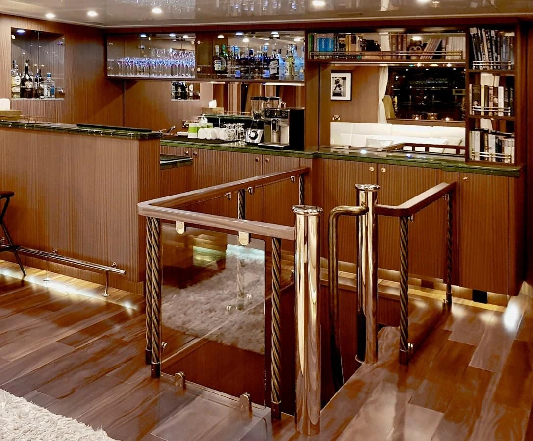 a bar with a table and chairs aboard BALTIC SEA Yacht for Sale
