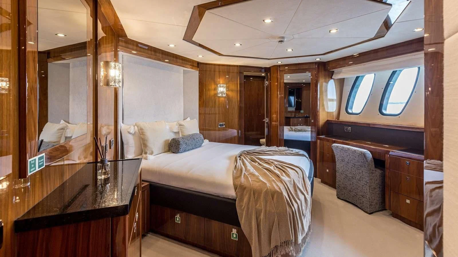 a room with a bed and a desk aboard KATARIINA I Yacht for Sale
